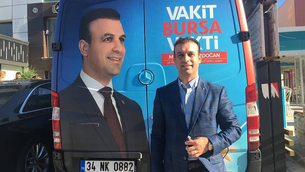 Muhammed Erdogan, the first Syrian turned Turkish citizen to run for parliament in Turkey, in front of his campaign truck.