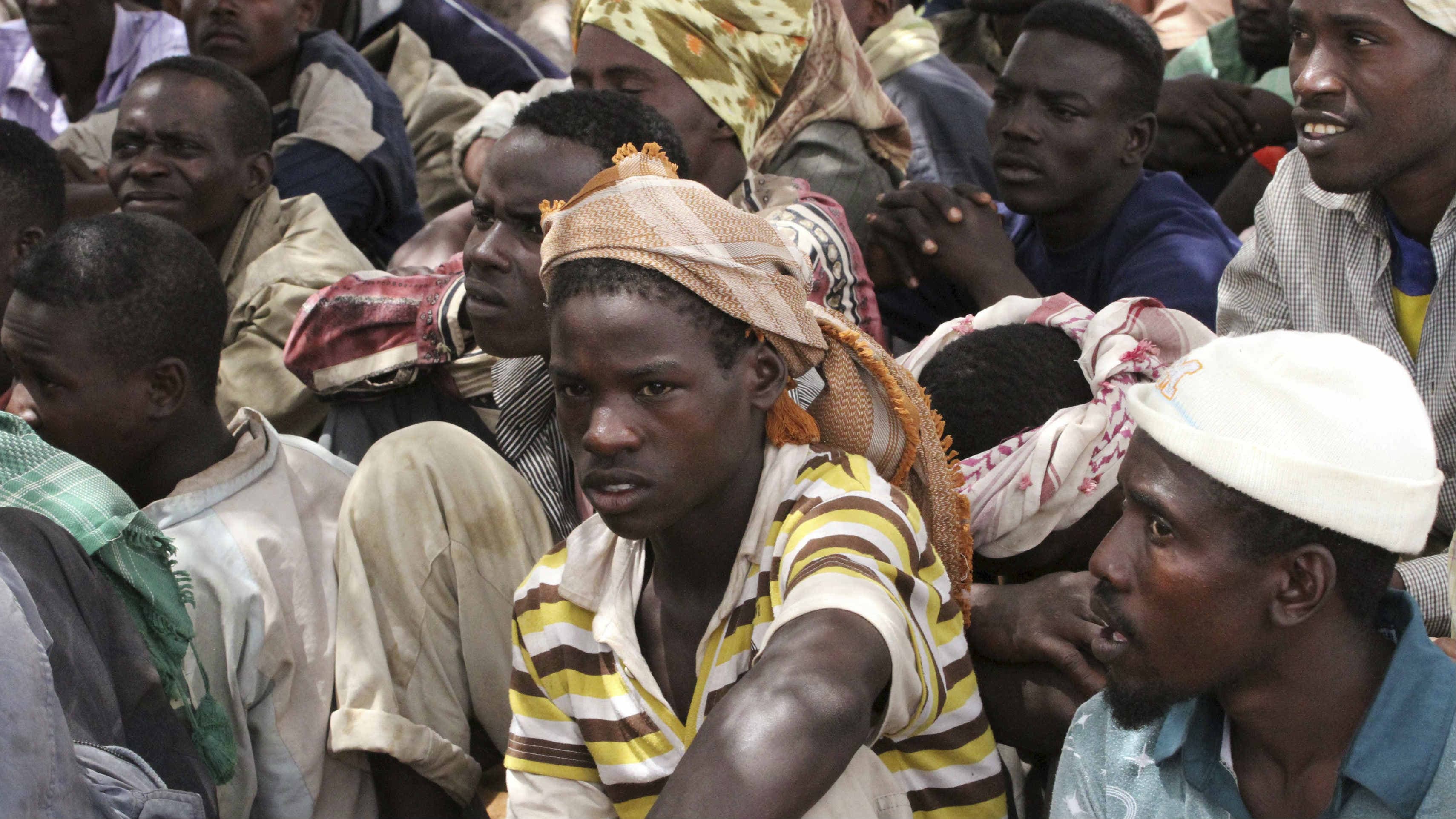 Members of the al-Qaeda-linked militant group al-Shabab surrender to authorities in the north of Somalia's capital Mogadishu, Sept. 24, 2012.