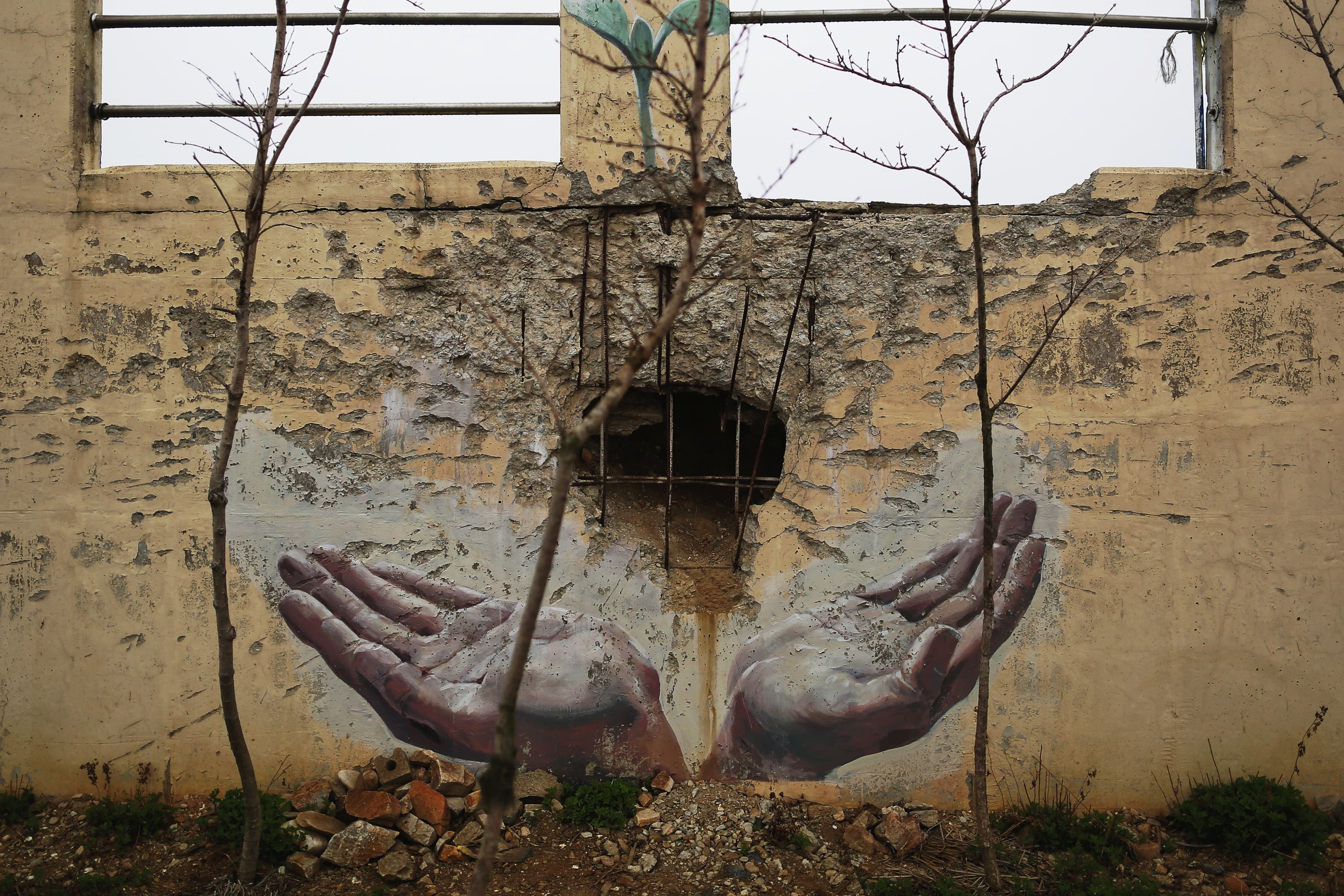 A painting is seen around the site where a shell landed during the 2010 North Korean attack