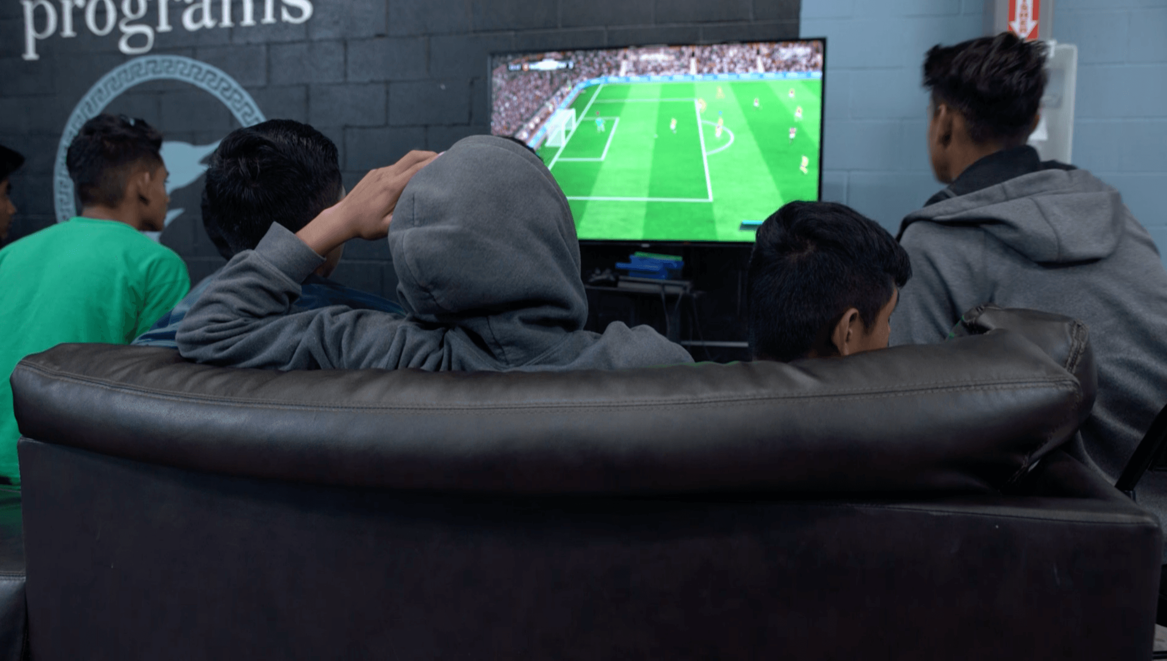 Teenage boys play video games at Casa Padre, a facility for migrant children in Brownsville, Texas.
