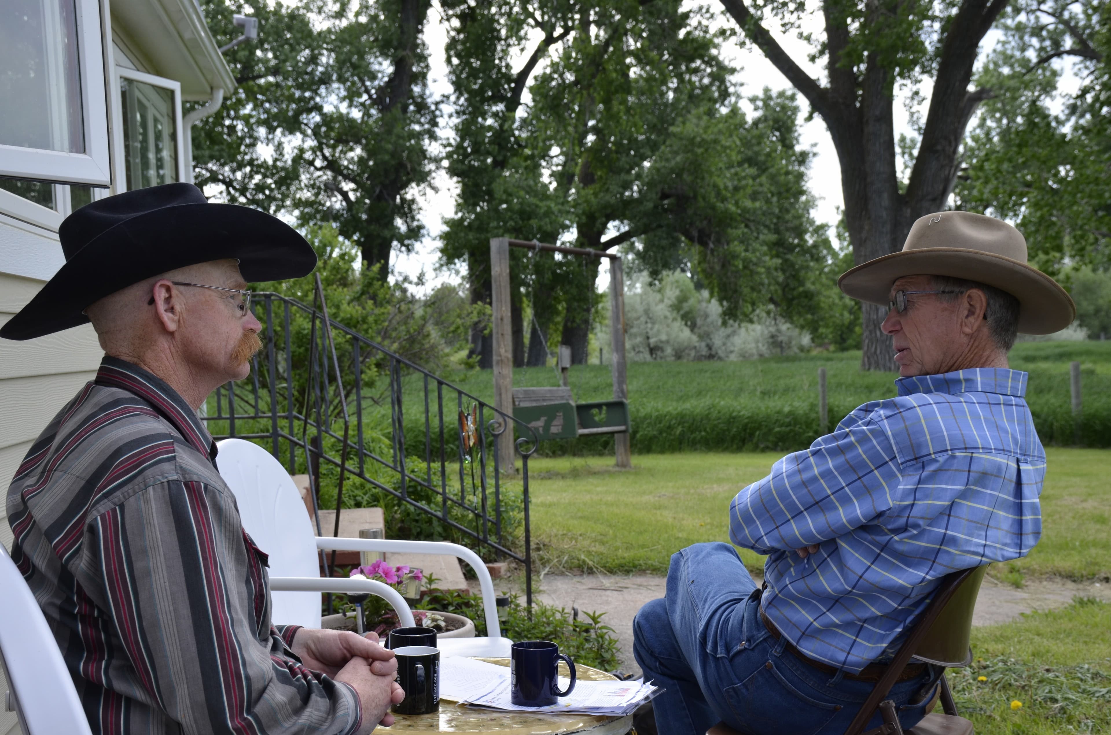 Eric Jennings, left, and Larry Stomprud at Jennings' ranch in Spearfish, SD. The two ranchers both support NAFTA.