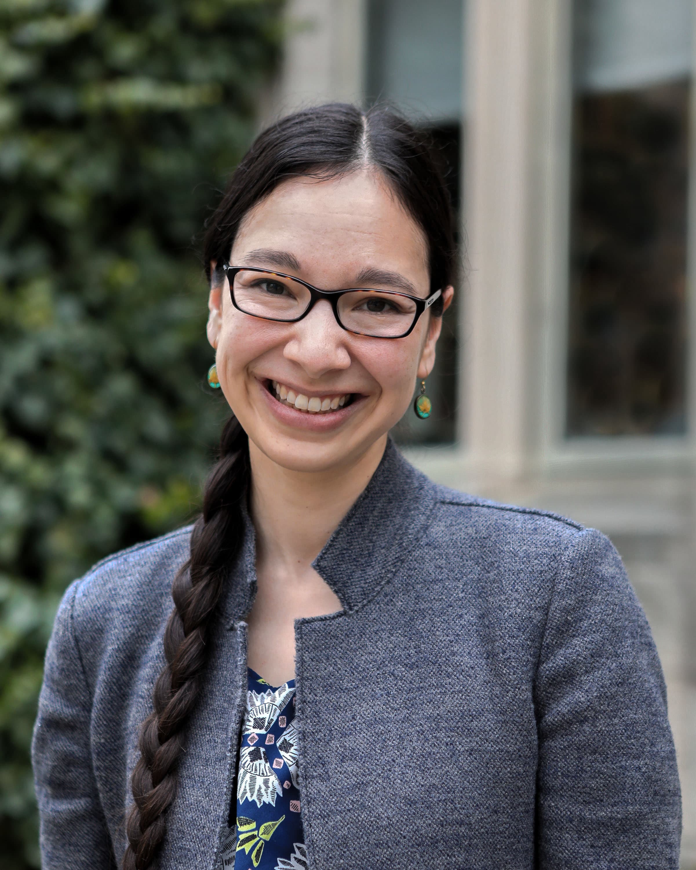 portrait of woman smilining, looking at camera