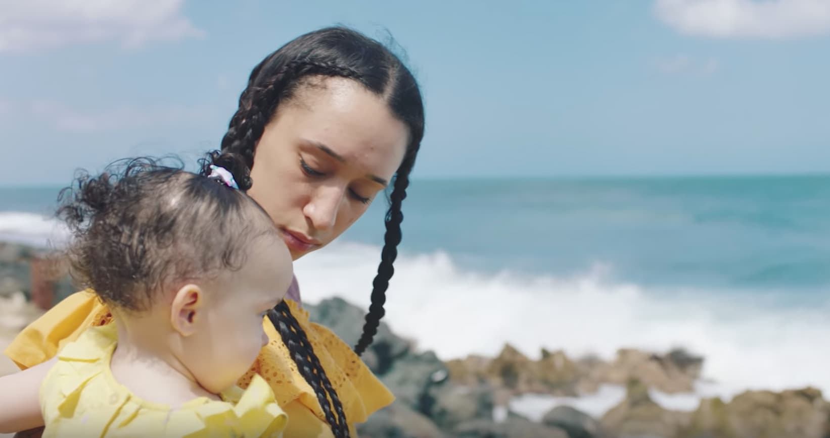 Mela Murder holds her daugther Amethyst in the Hurray for the Riff Raff Music video for Palante