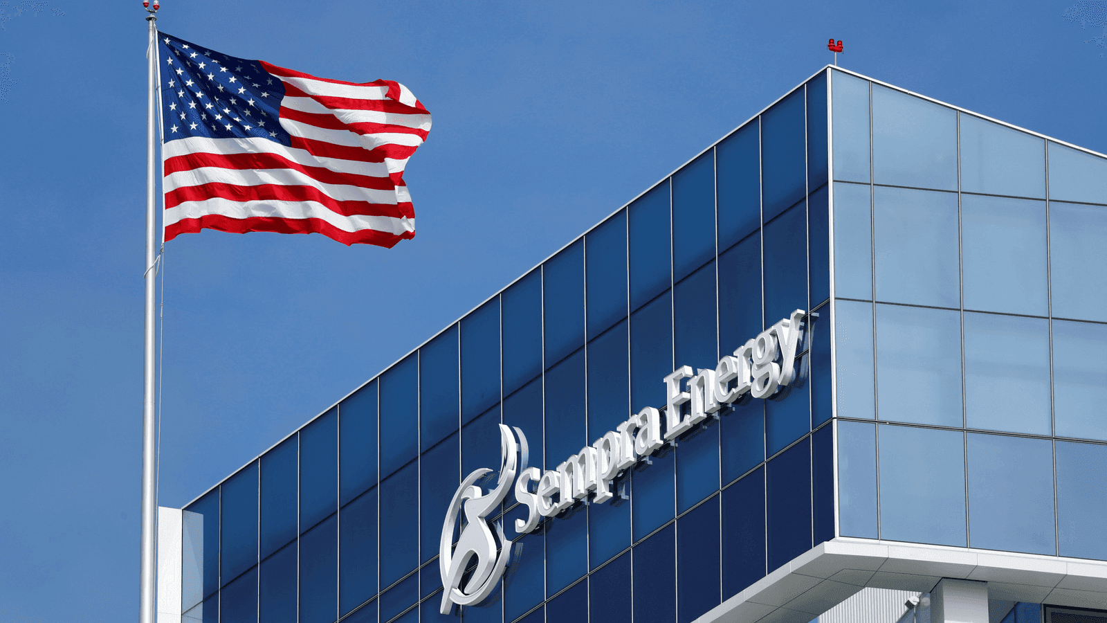 a corporate headquarters building and an american flag