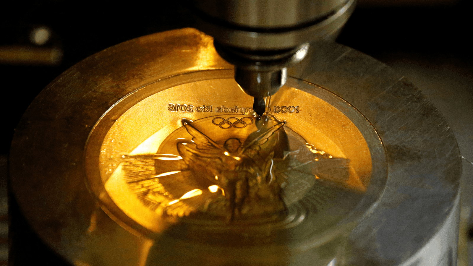 a machine makes a medal in brazil for olympic winners