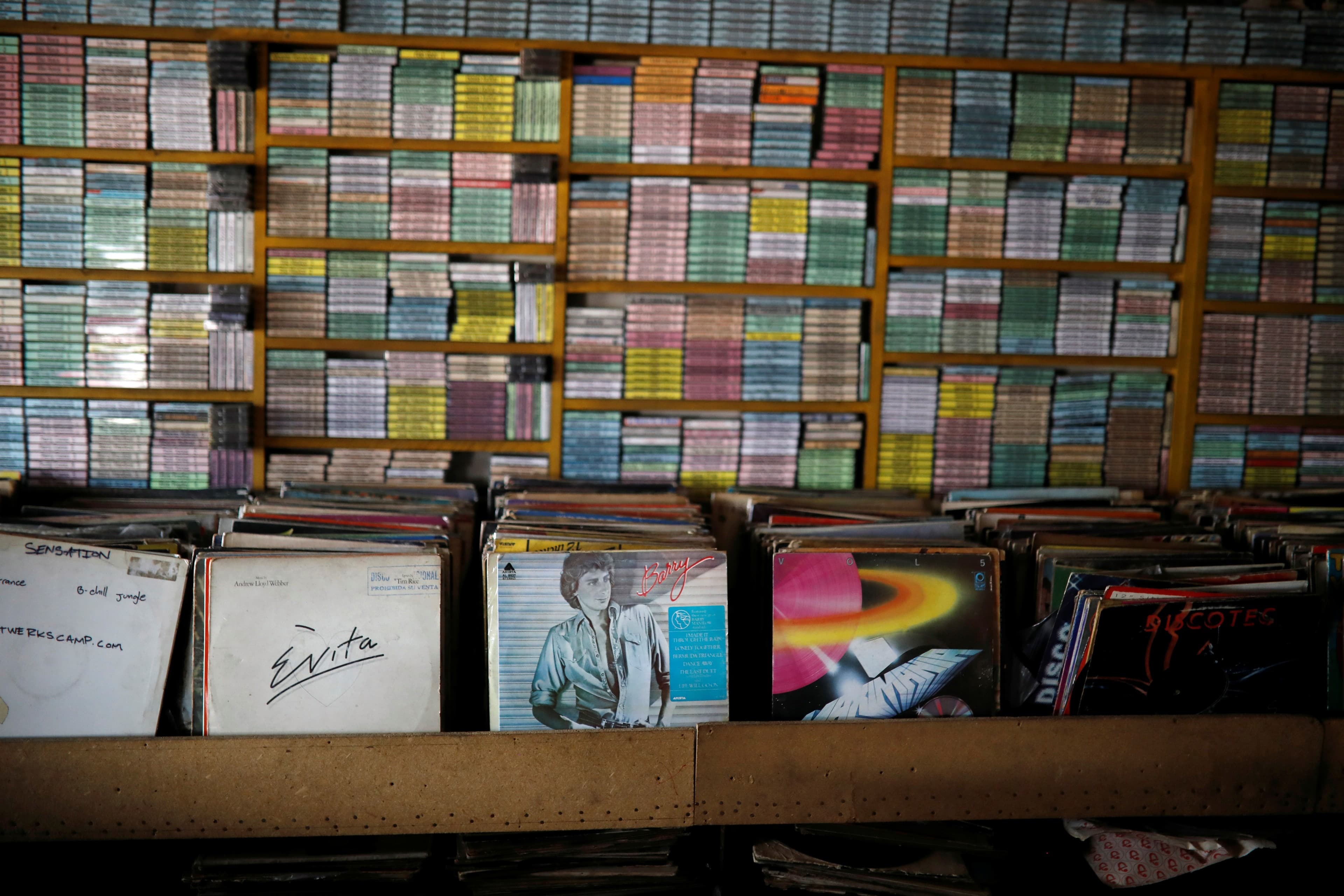 vinyl records lined up at a record shop