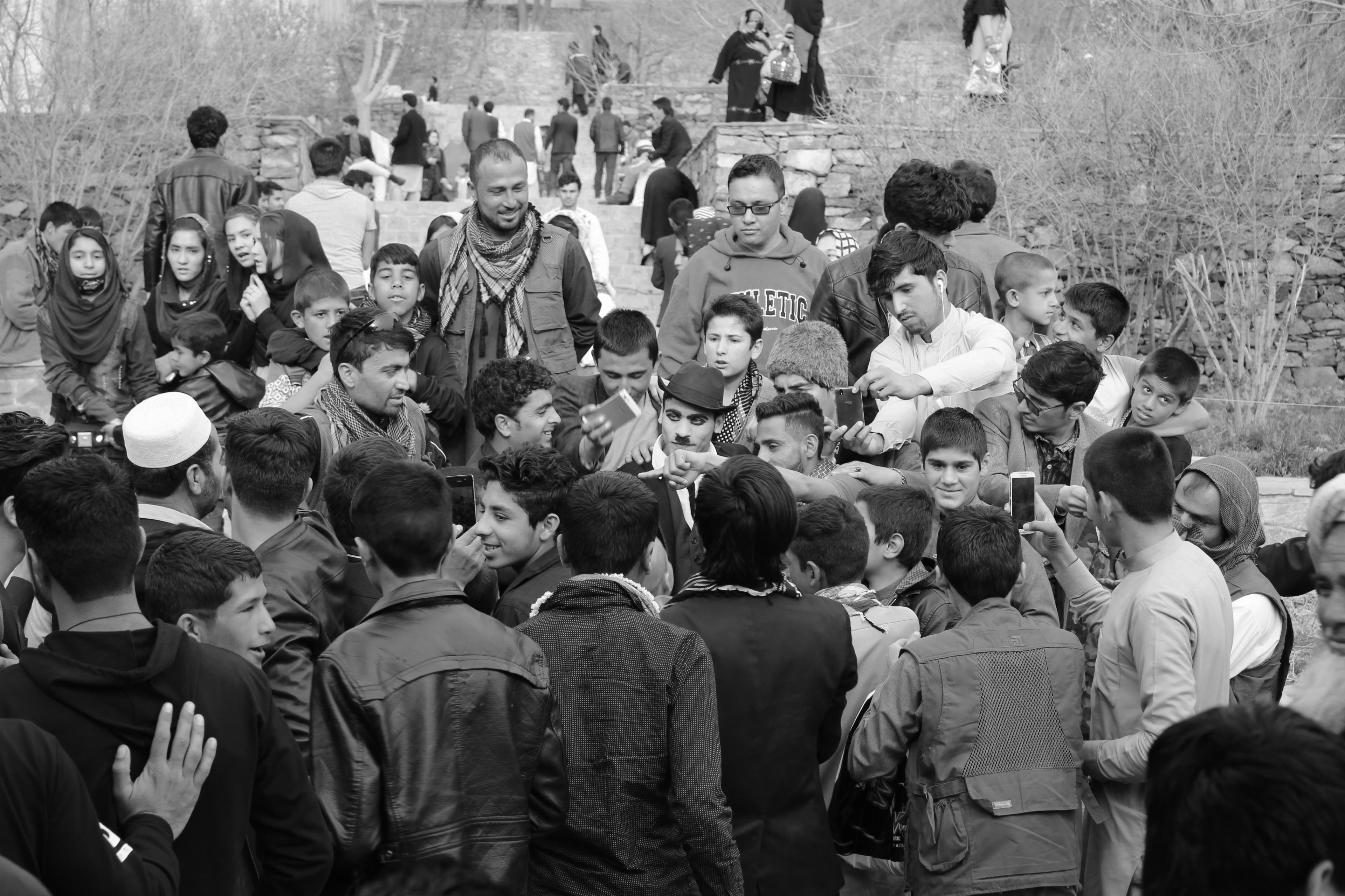 Spectators gather to take selfies with Karim Asir, also known as 'Afghani Charlie Chaplin'.