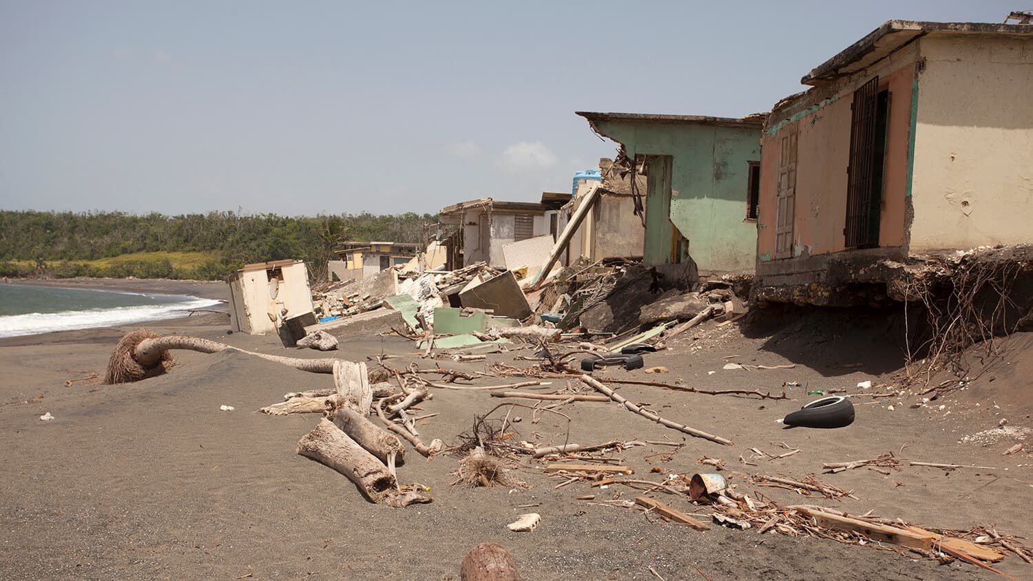 Destroyed homes on a beach
