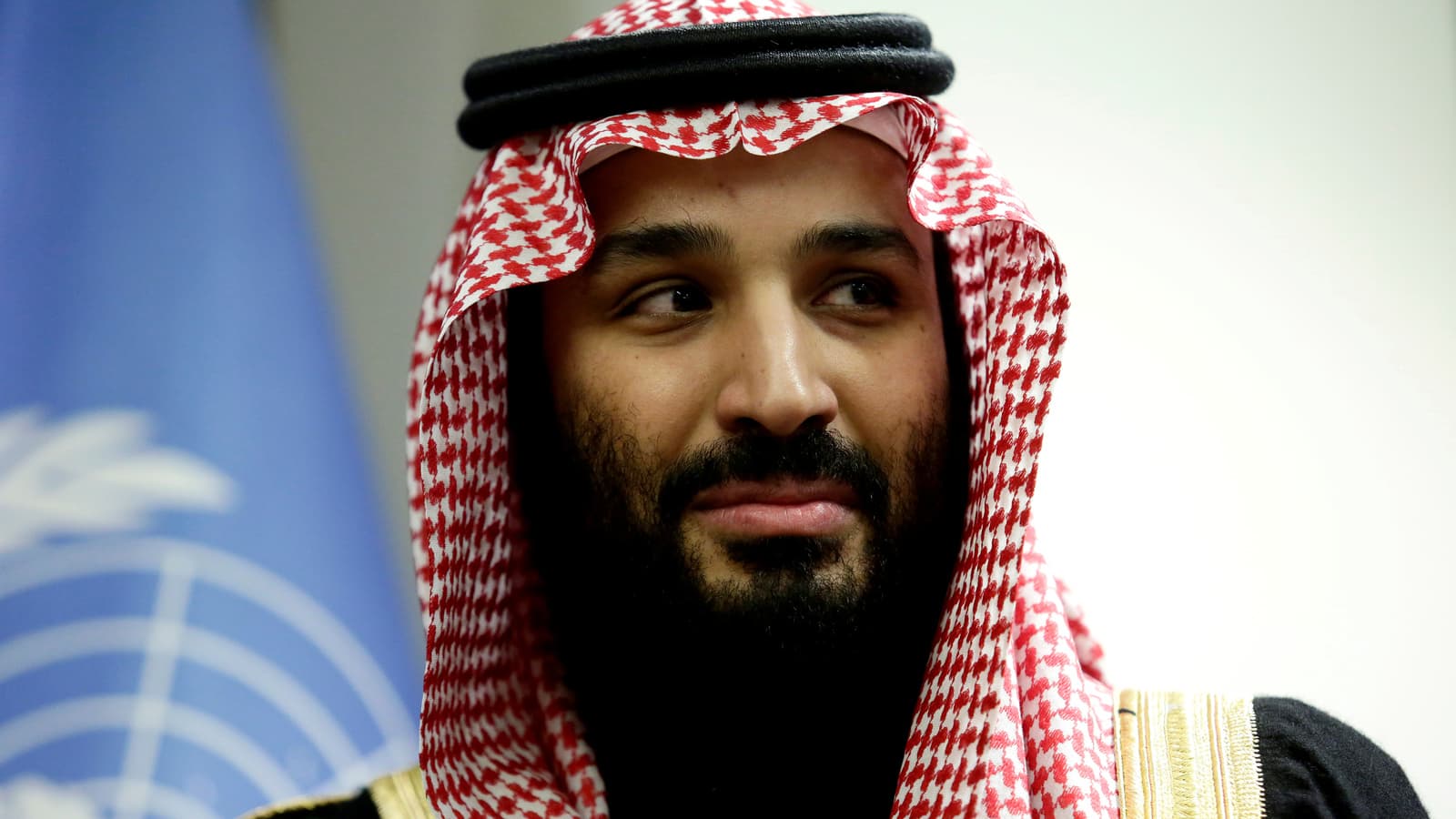 Crown Prince Mohammed bin Salman wears traditional red and white checkered scarf headdress.