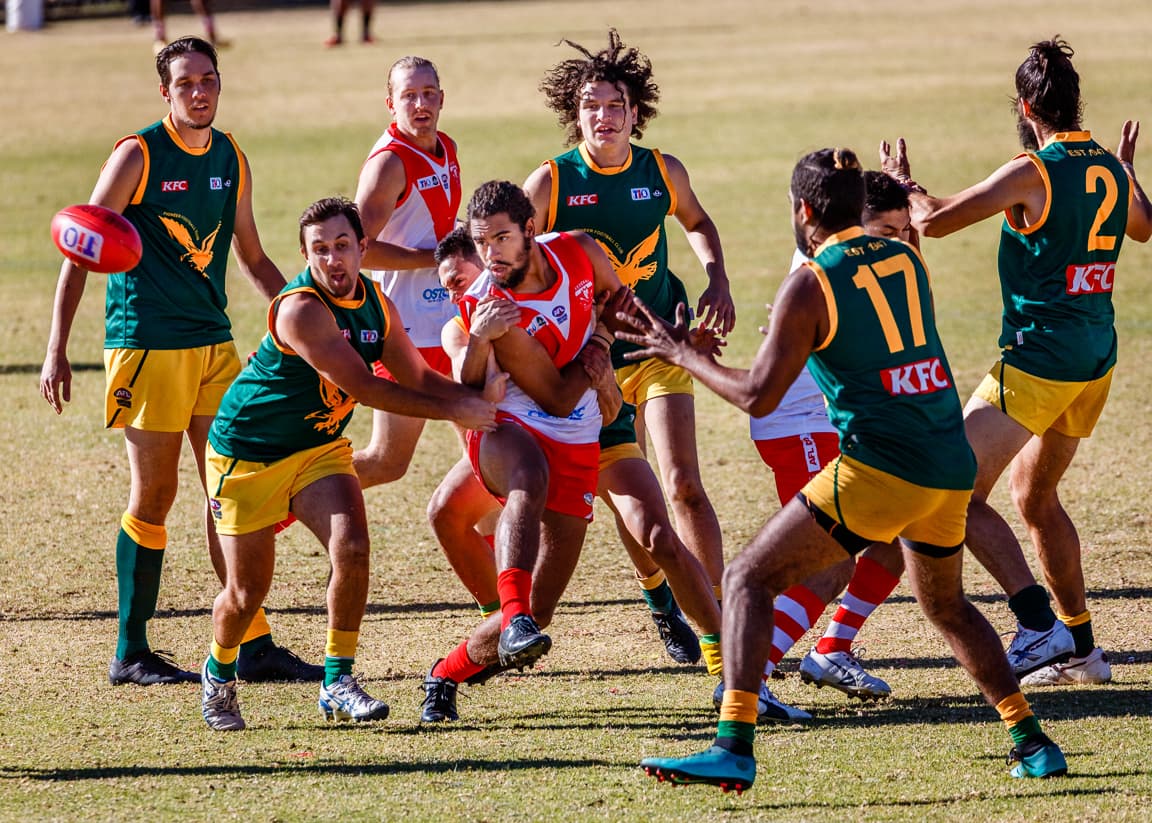 A ball is thrown in game of Australian Rules Football taking place in Alice Springs, in Australia's Northern Territory.