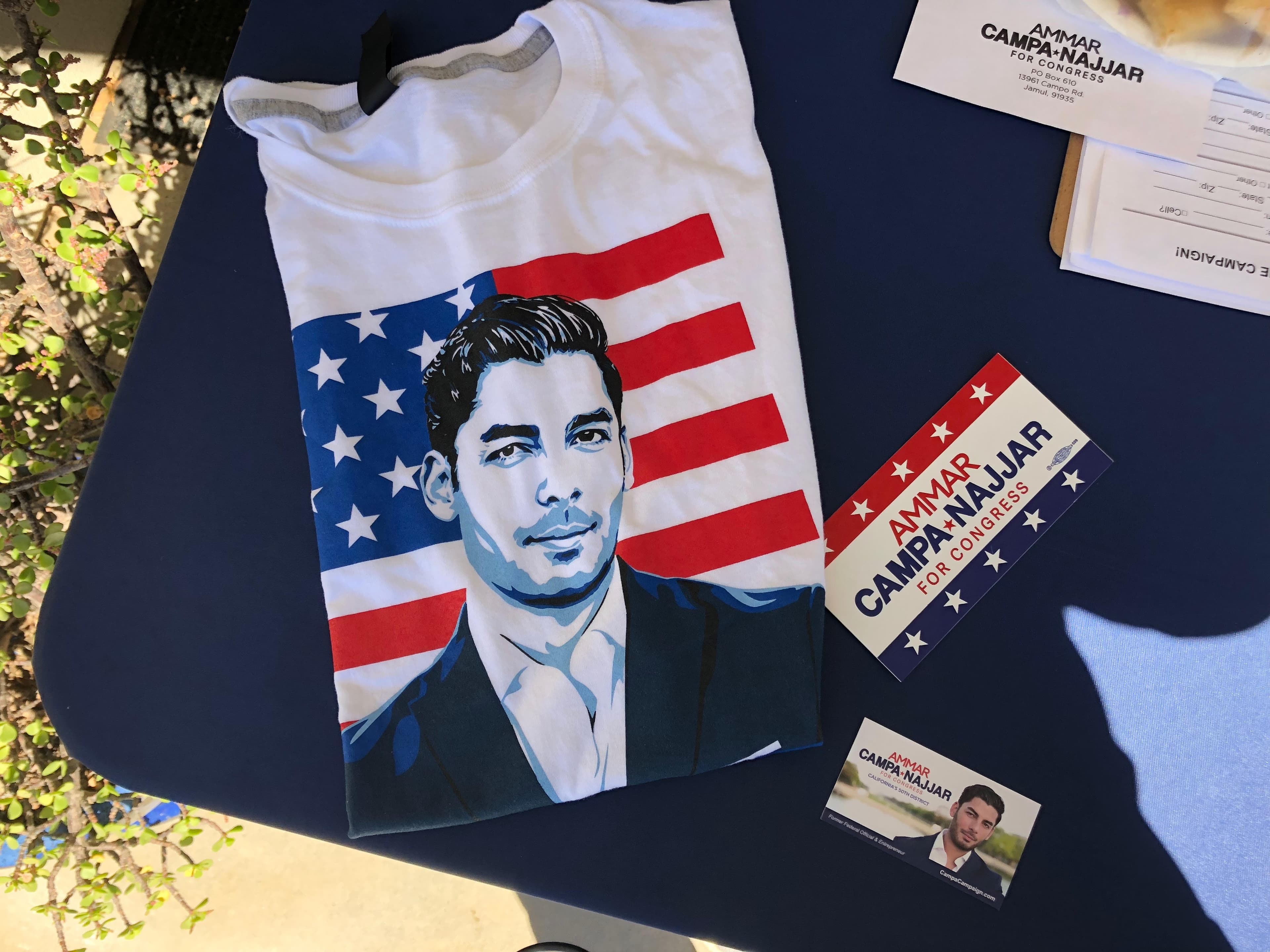 pamhplets, T-shirt with man's face on table