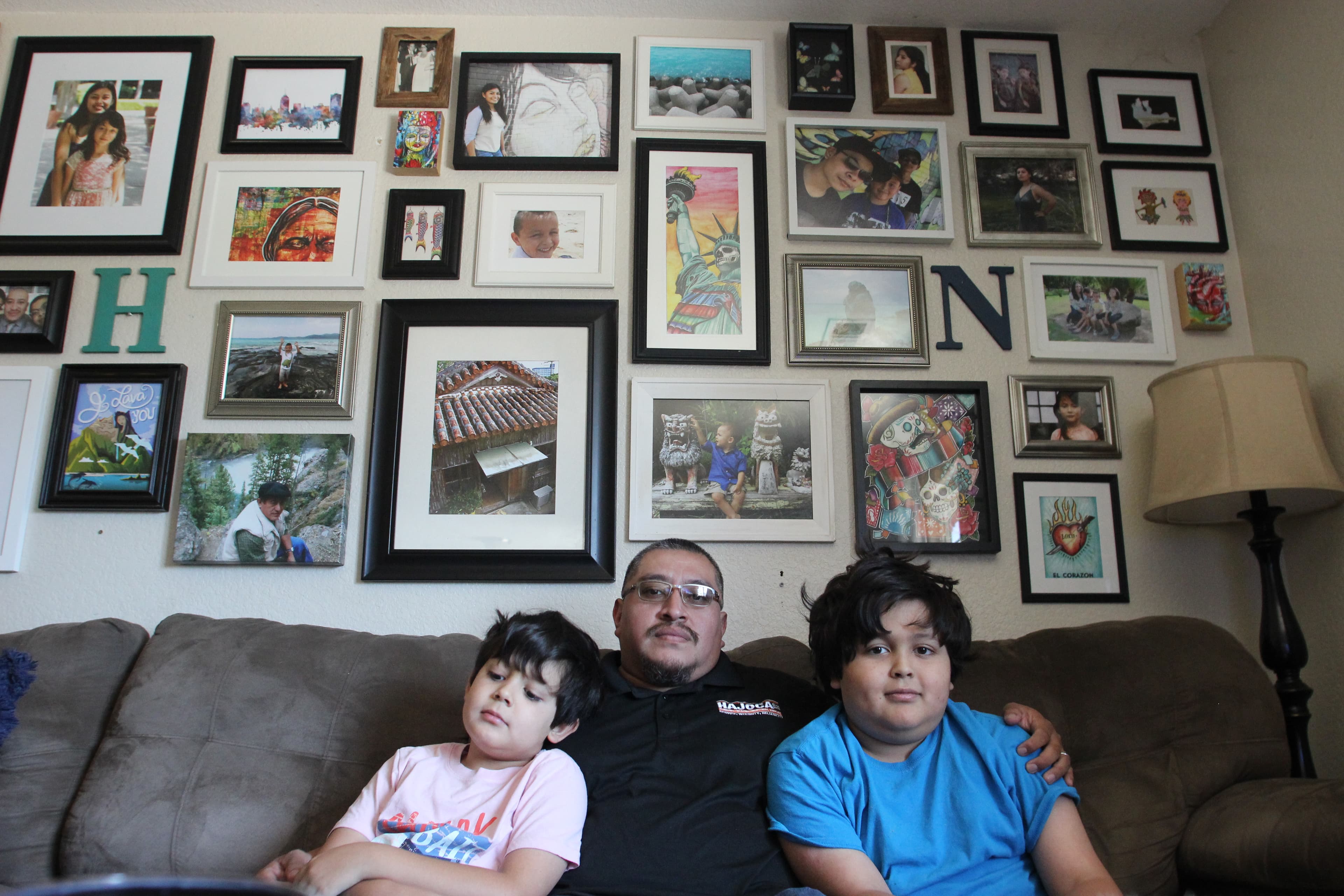 a man with his children sitting on a couch