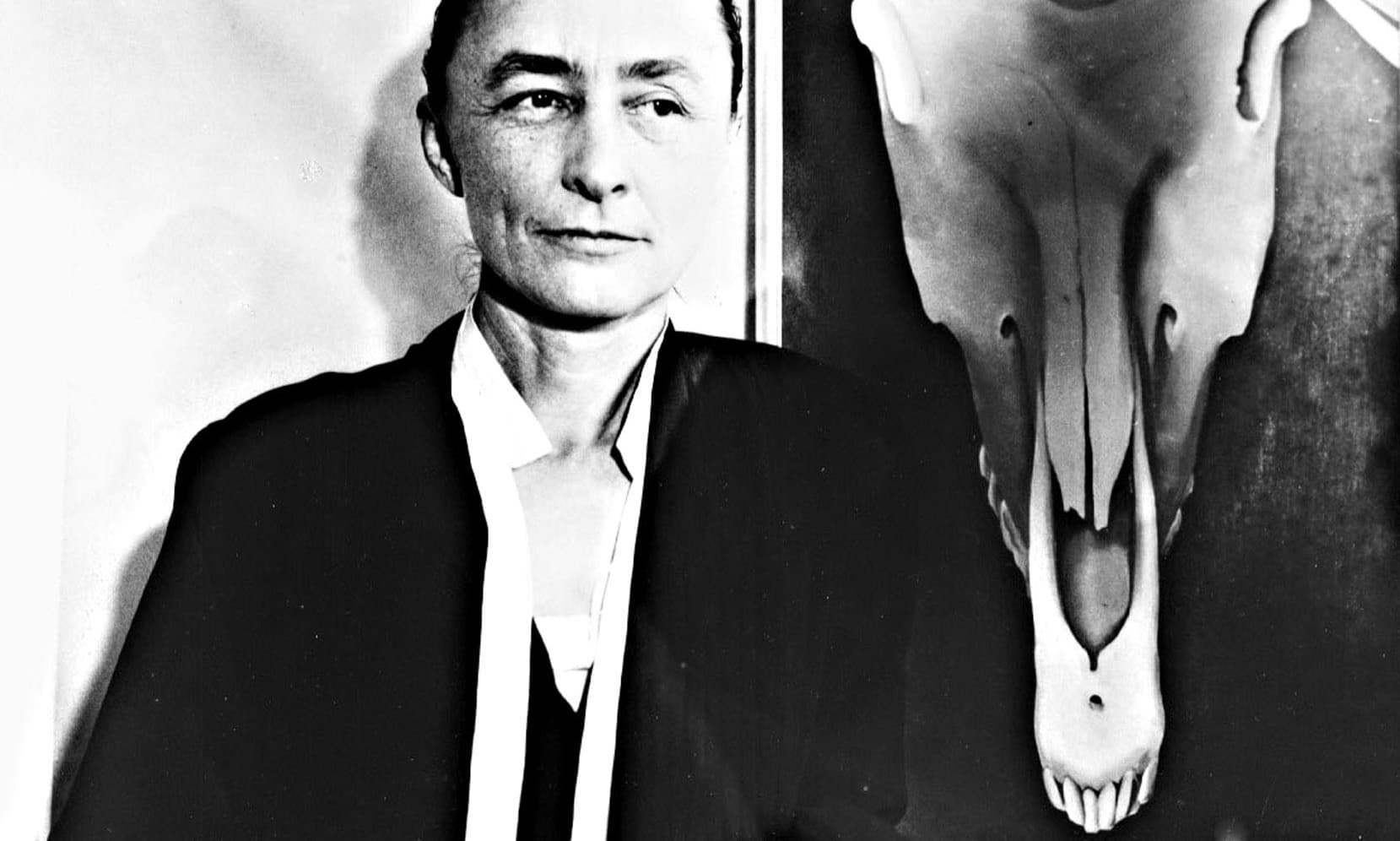 Georgia O'Keeffe and one of her skull paintings in 1931.