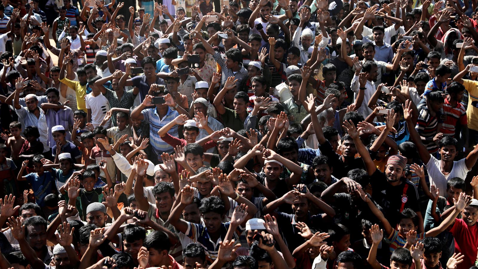 Hundreds of Rohingya refugees shout slogans as they protest against their repatriation