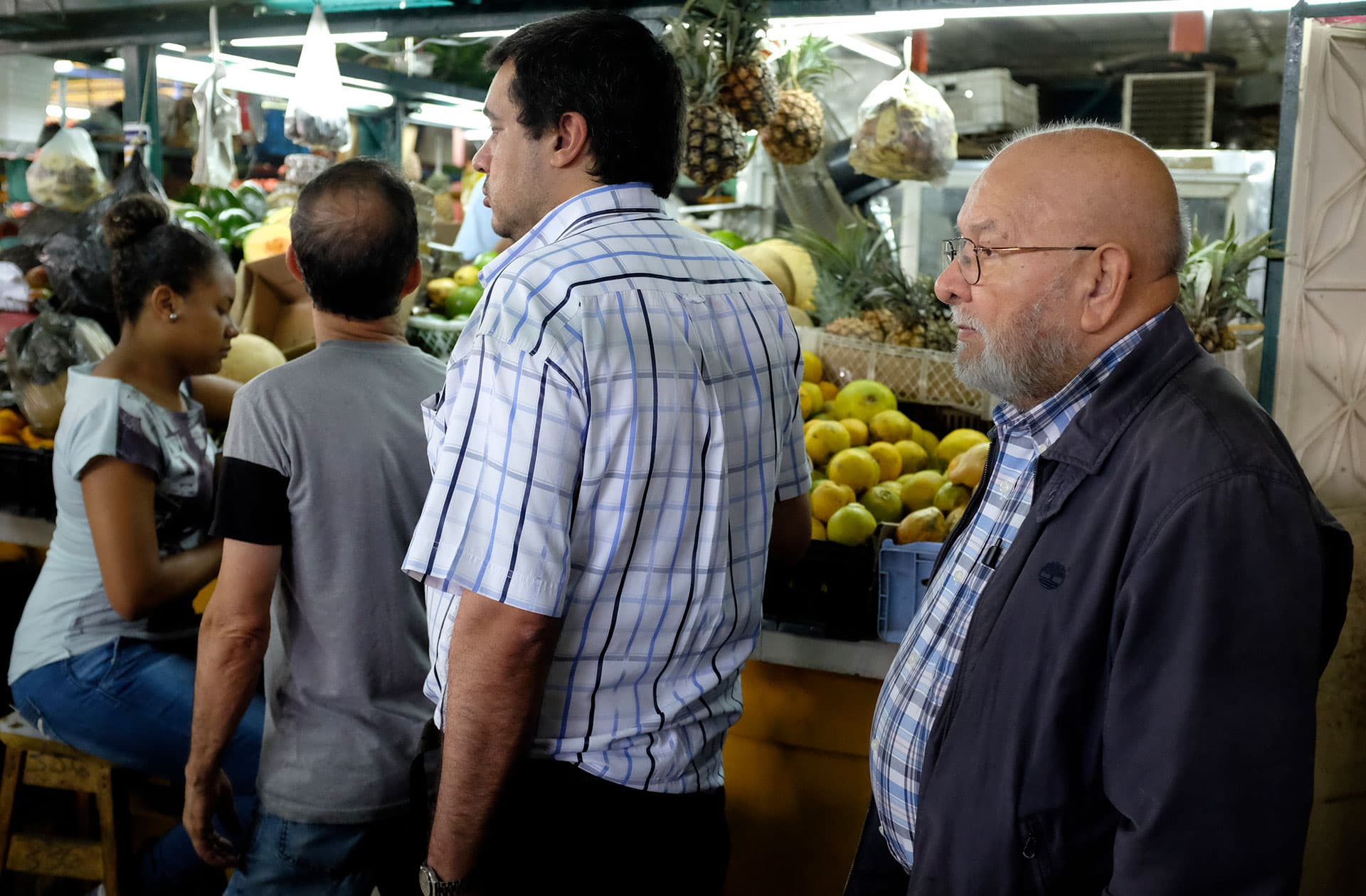 Benito Urrea standing in line at a grocery store