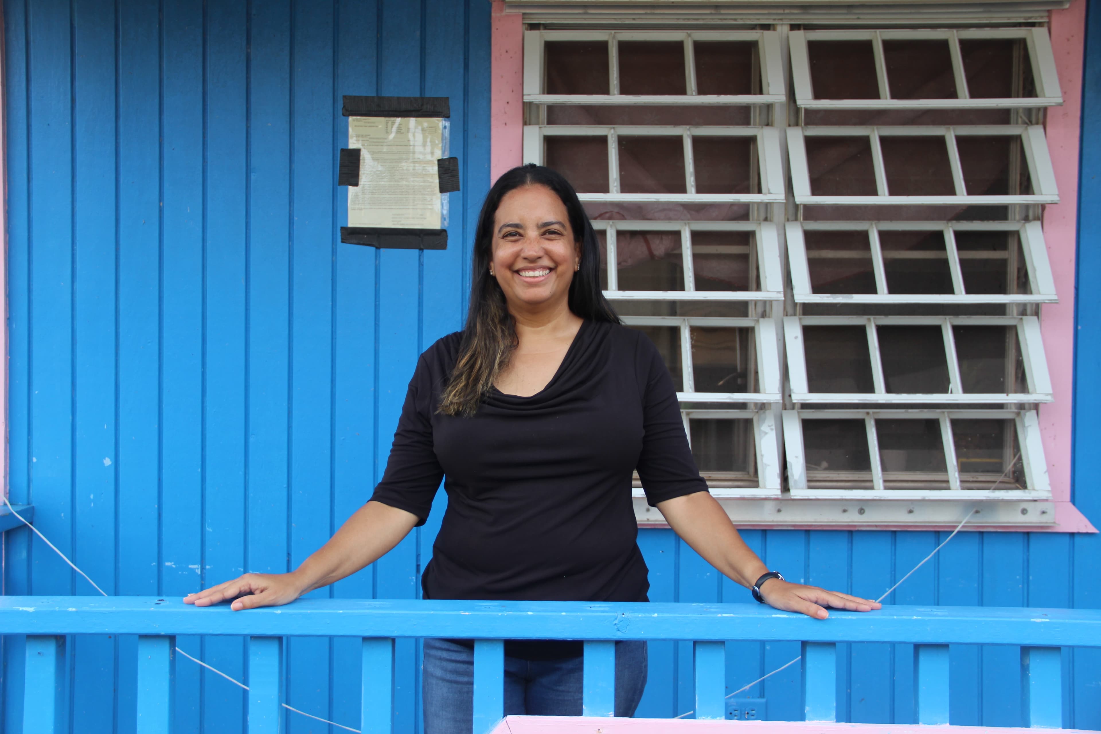 Woman outside her home