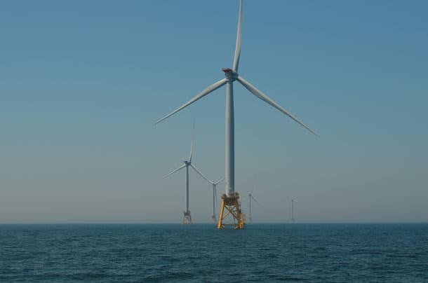 Wind turbine against a blue sky.