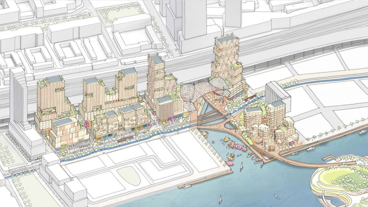 An illustration of tall buildings next to a river in a dense city