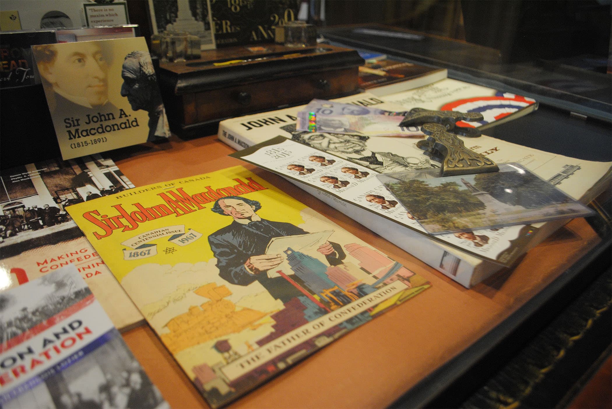 a yellow cover of a magazine with an illustration of John A. Macdonald