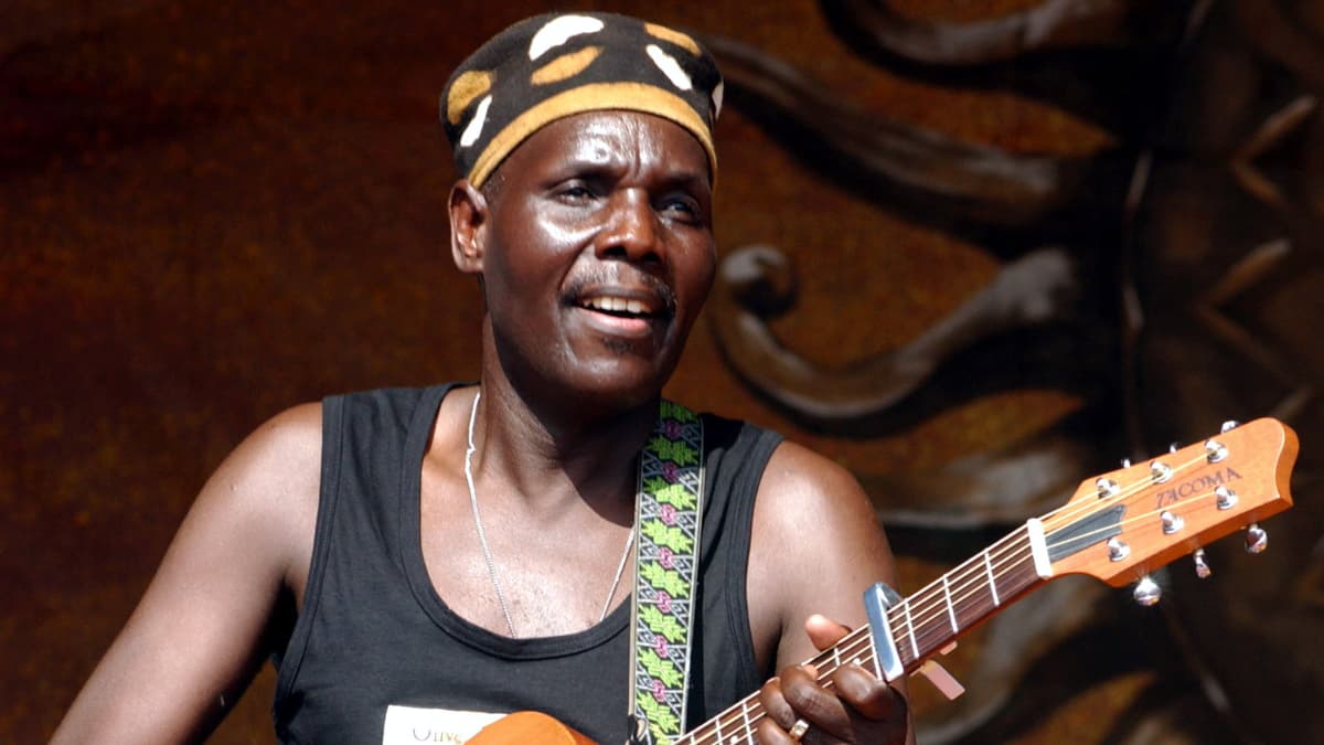 Oliver Mtukudzi plays guitar