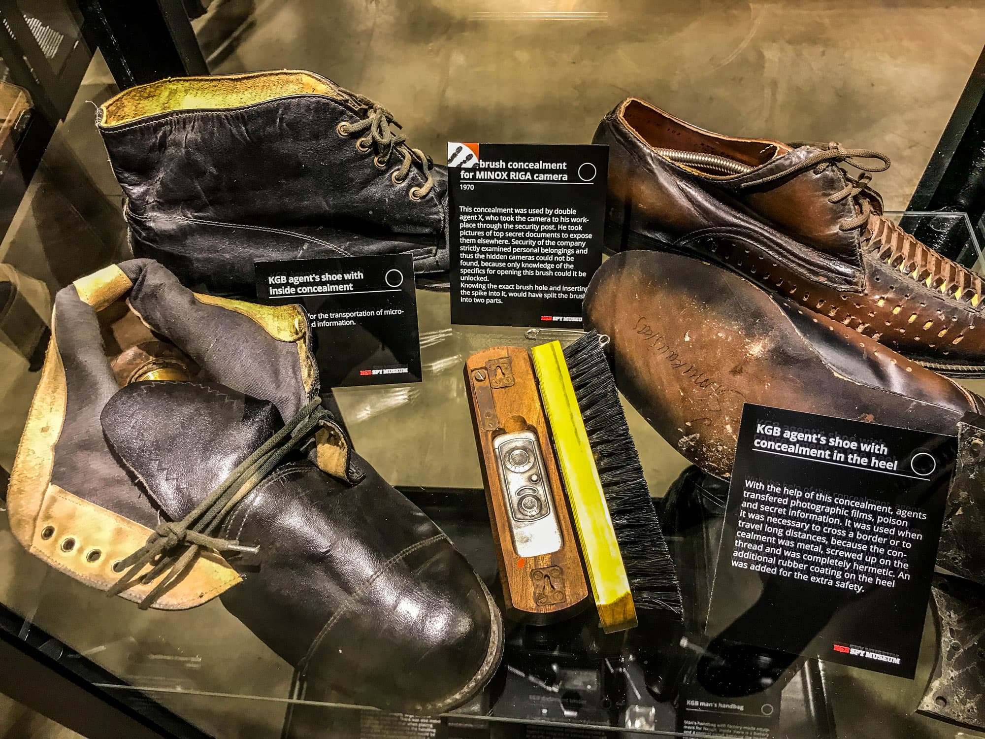 A KGB concealment device — used to transport anything from film negatives to vials of poison — is tucked into an ordinary shoe polishing brush.