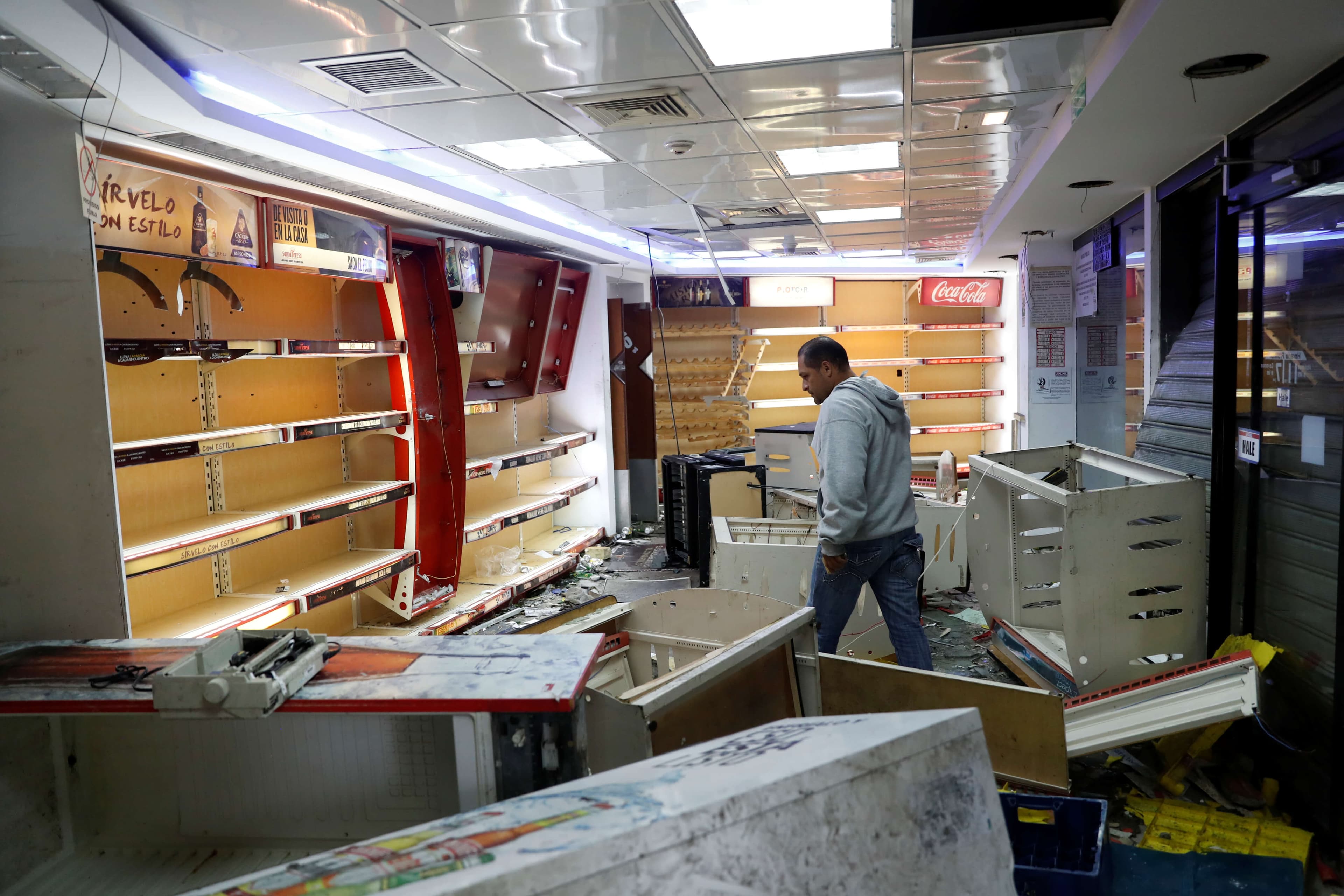 the inside of an empty and damaged store