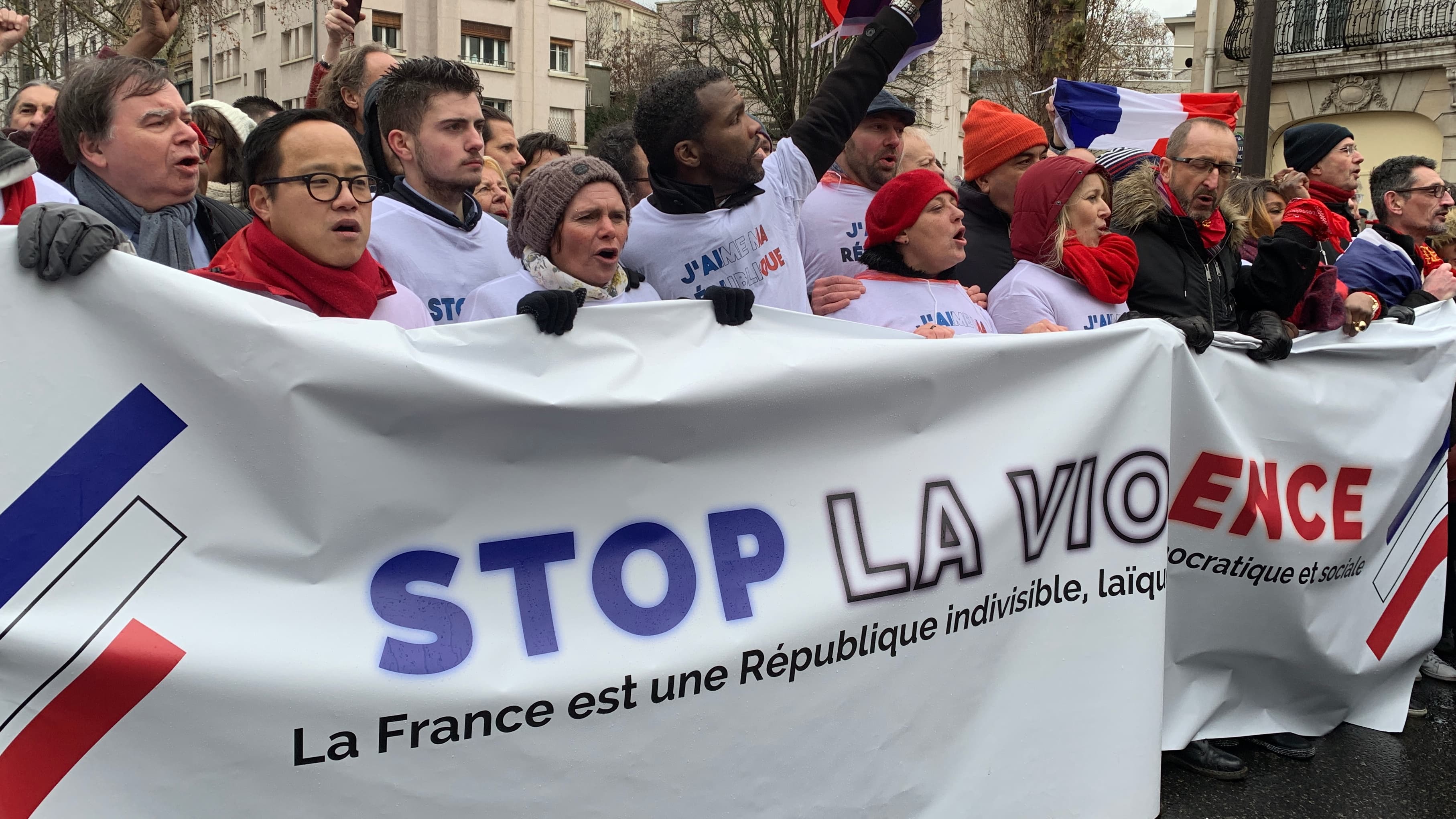 Protesters hold an anti-violence banner in Paris.