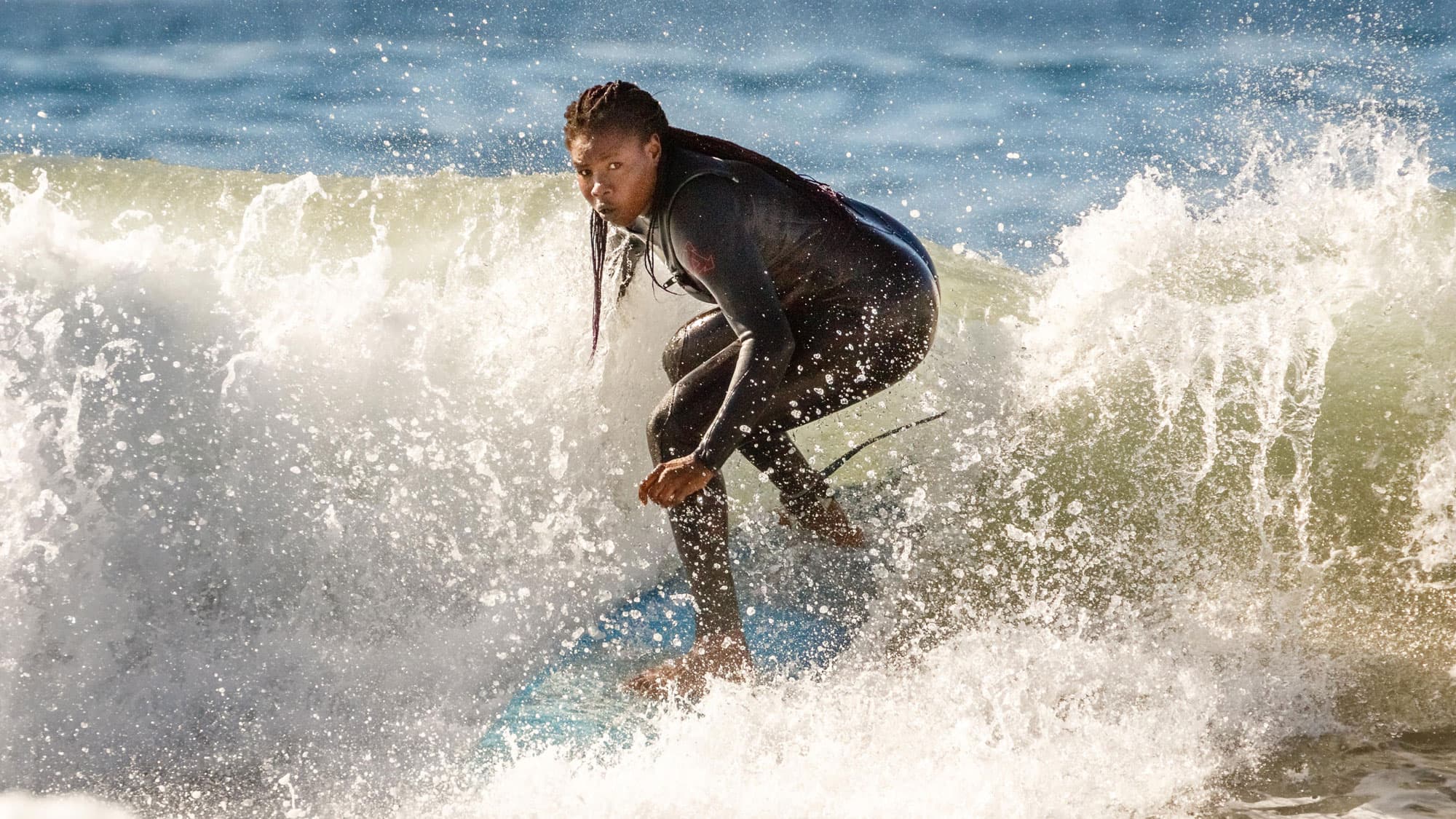 A woman on a surfboard