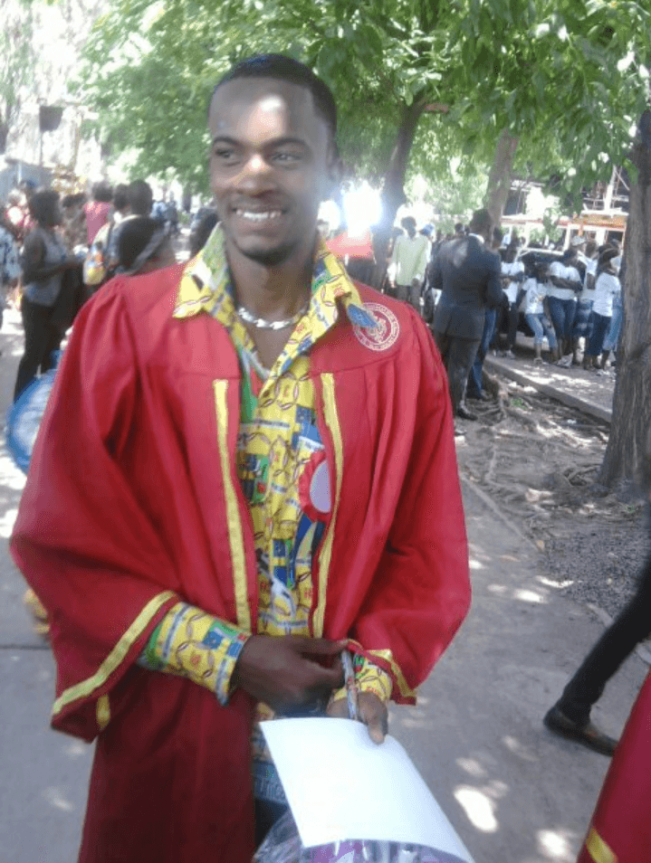 Alex Bukasa, a Congolese asylum-seeker and former journalist, wears a red robe as he poses at home in Kinshasa.