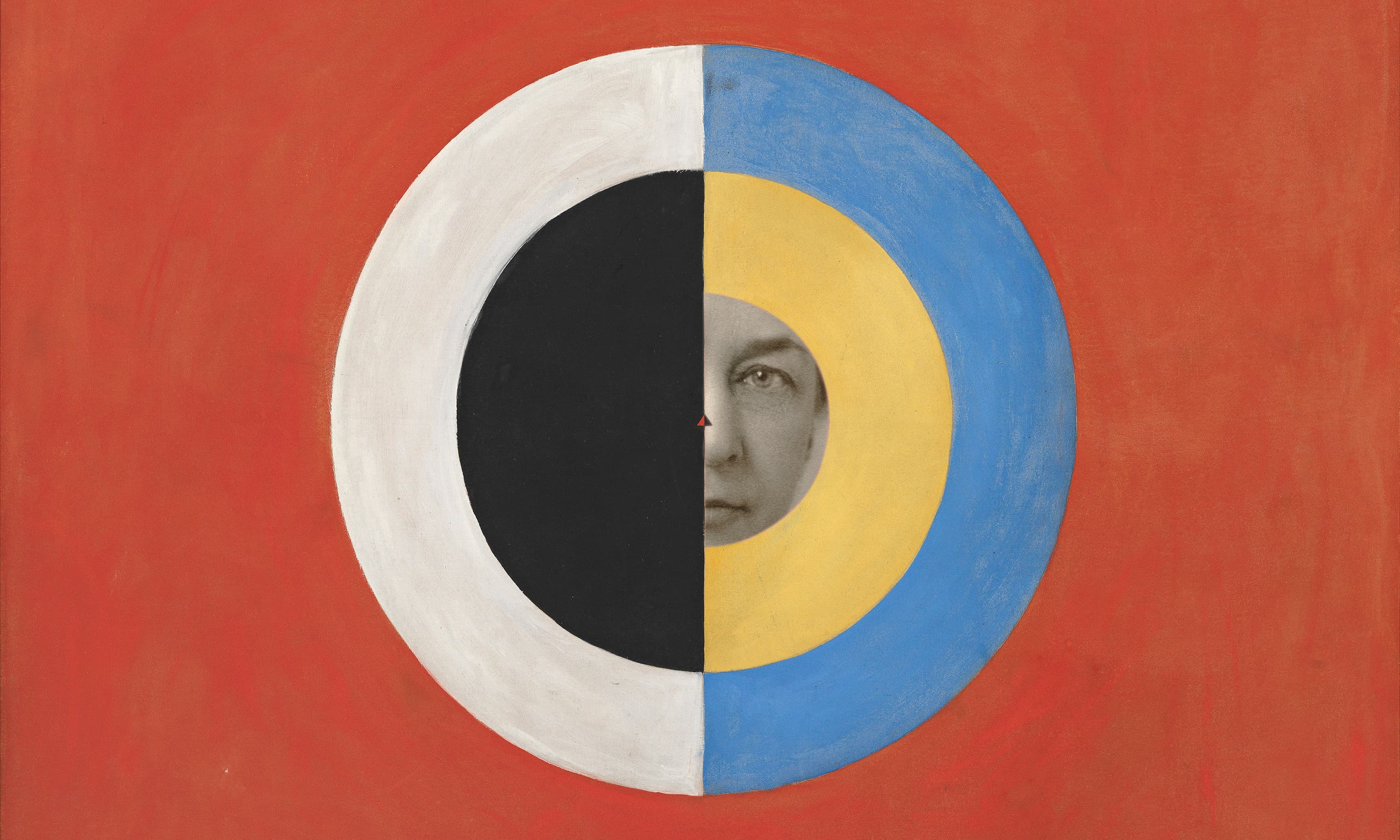 Portrait of Hilma af Klint, circa 1910s, behind one of her paintings, “Group IX/SUW, The Swan, No. 17 (Grupp IX/SUW, Svanen, nr 17),” 1915 from “The SUW/UW Series (Serie SUW/UW).”