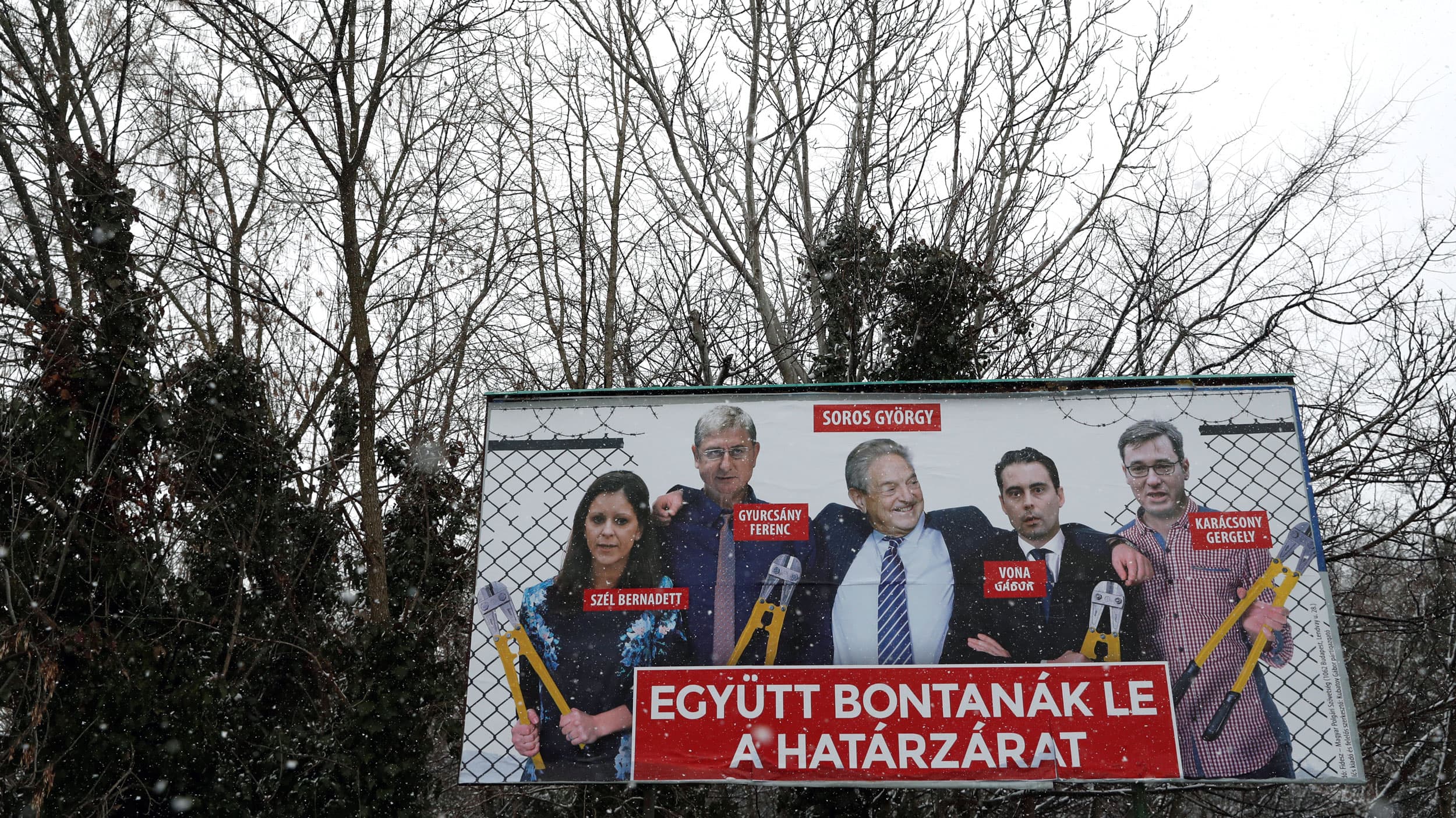 A billboard shows billionaire George Soros and other Hungarian opposition leaders.