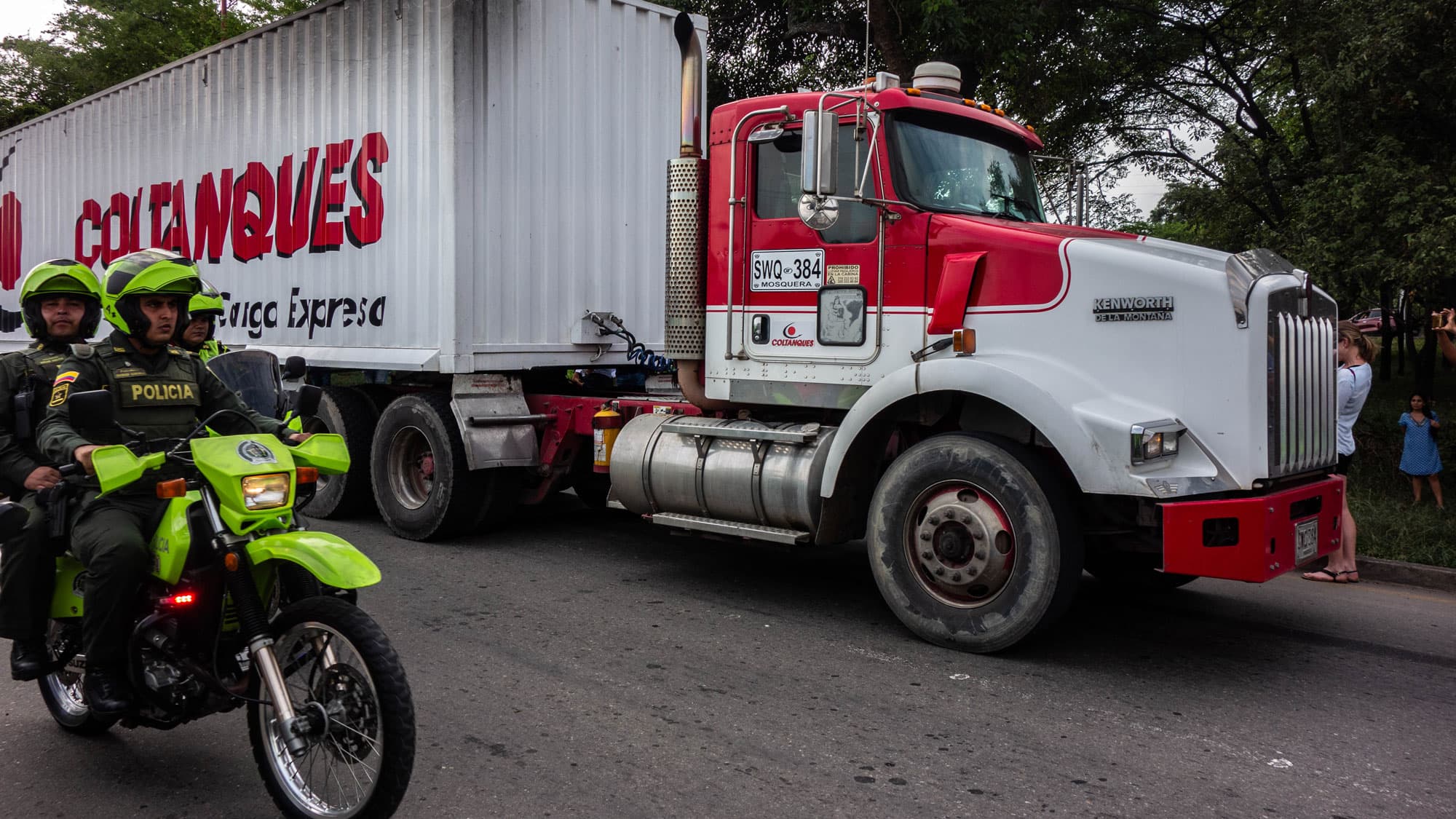 A large white truck with red lettering