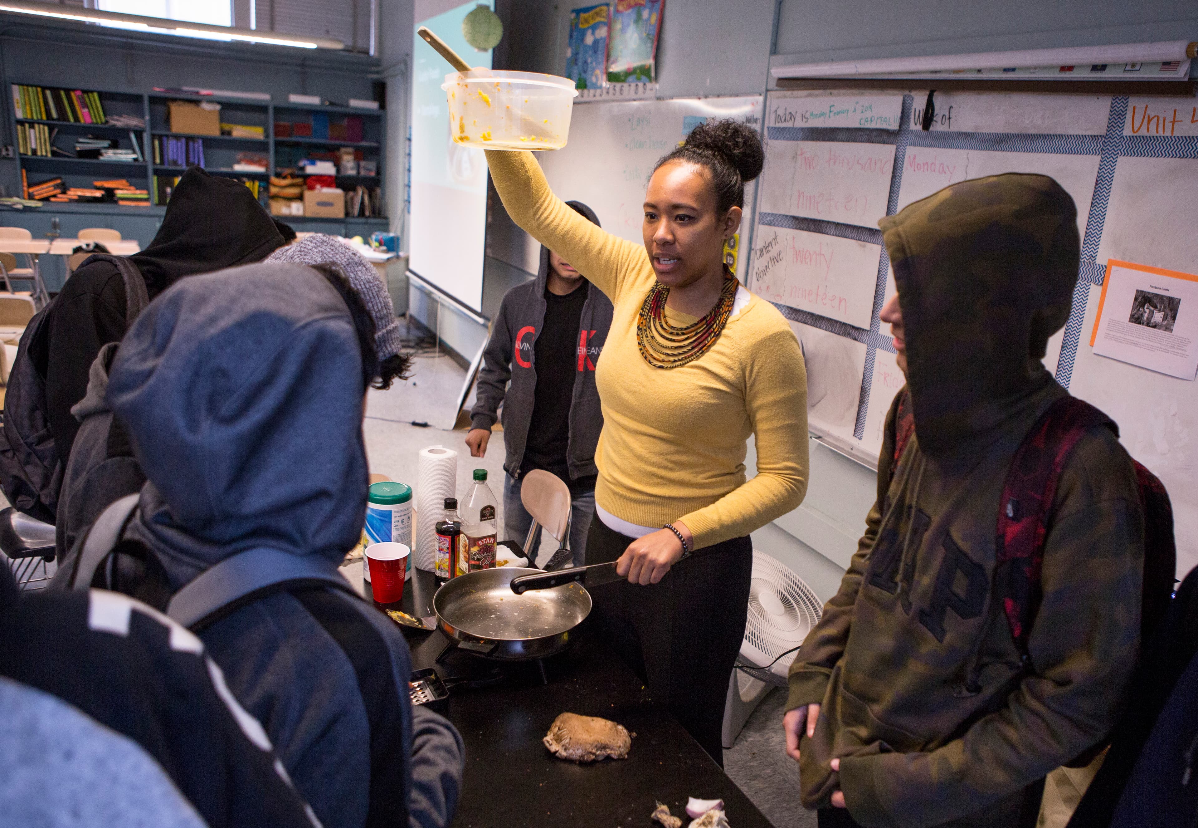 A teacher is cooking.