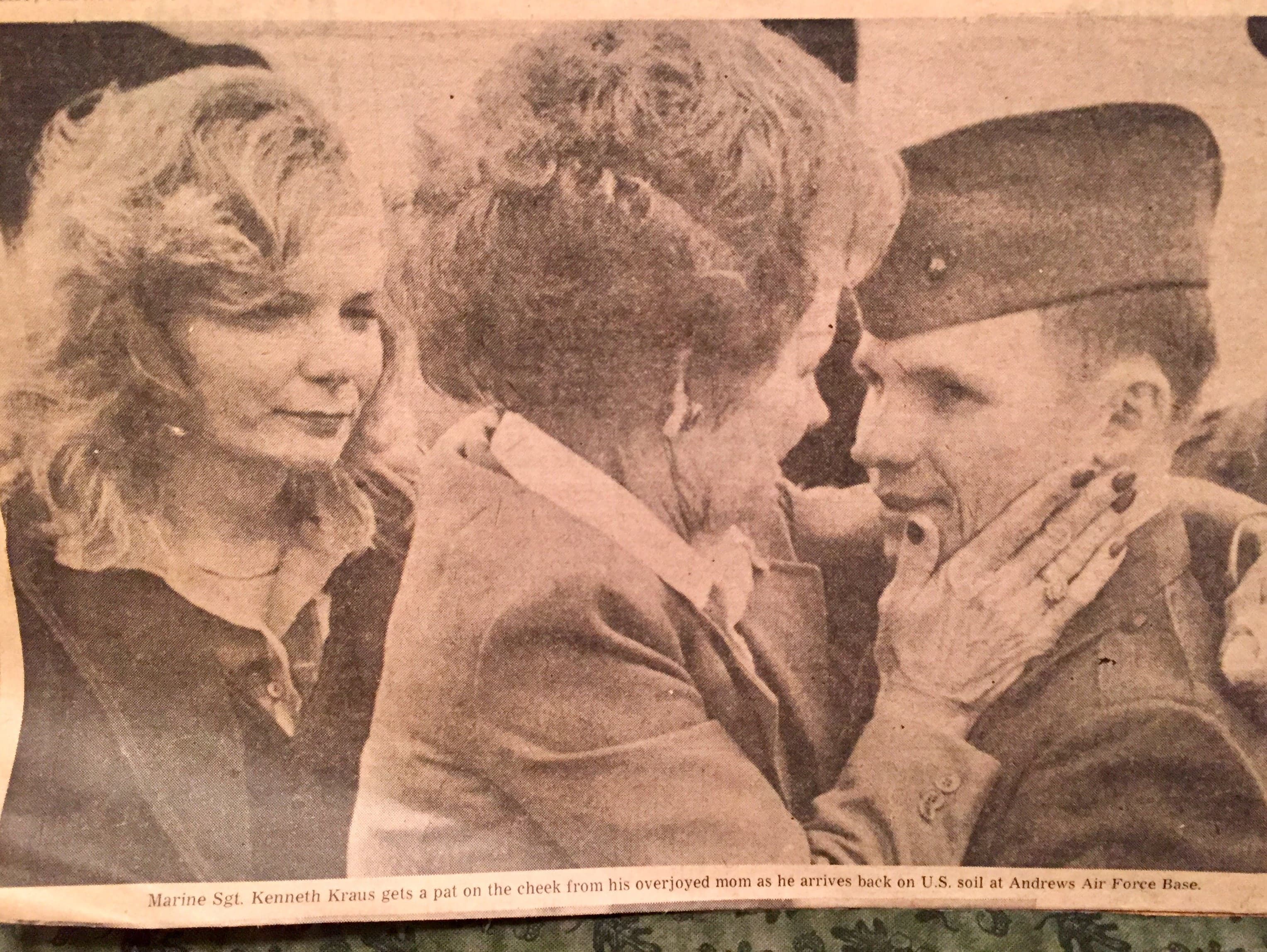Marine Sgt. Kenneth Kraus gets a pat on the cheek from his overjoyed mom
