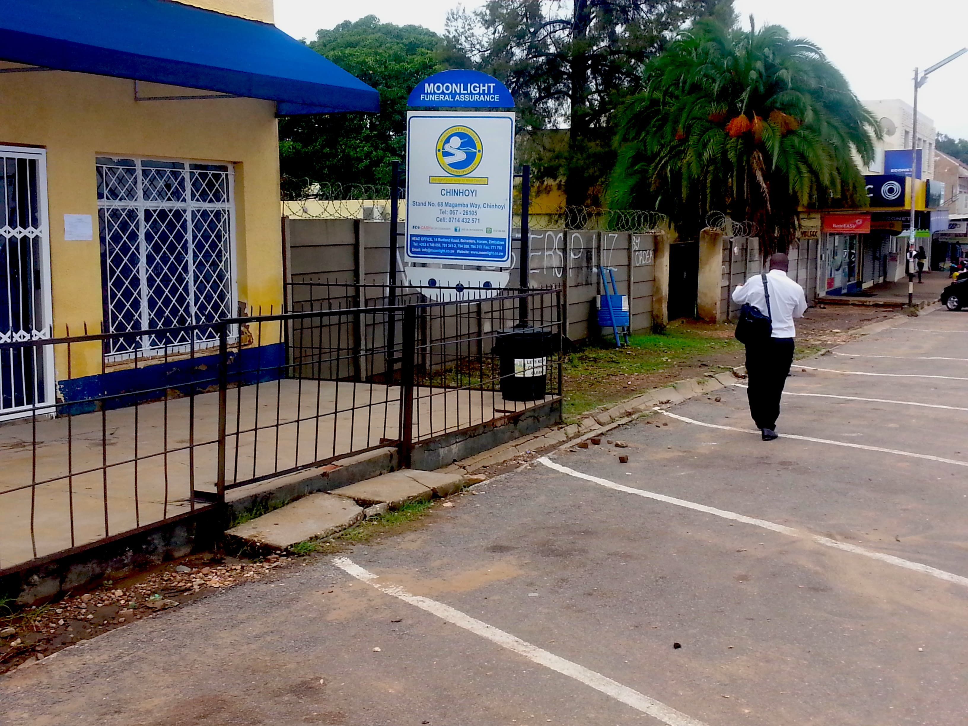 Moonlight funeral business sign in blue.