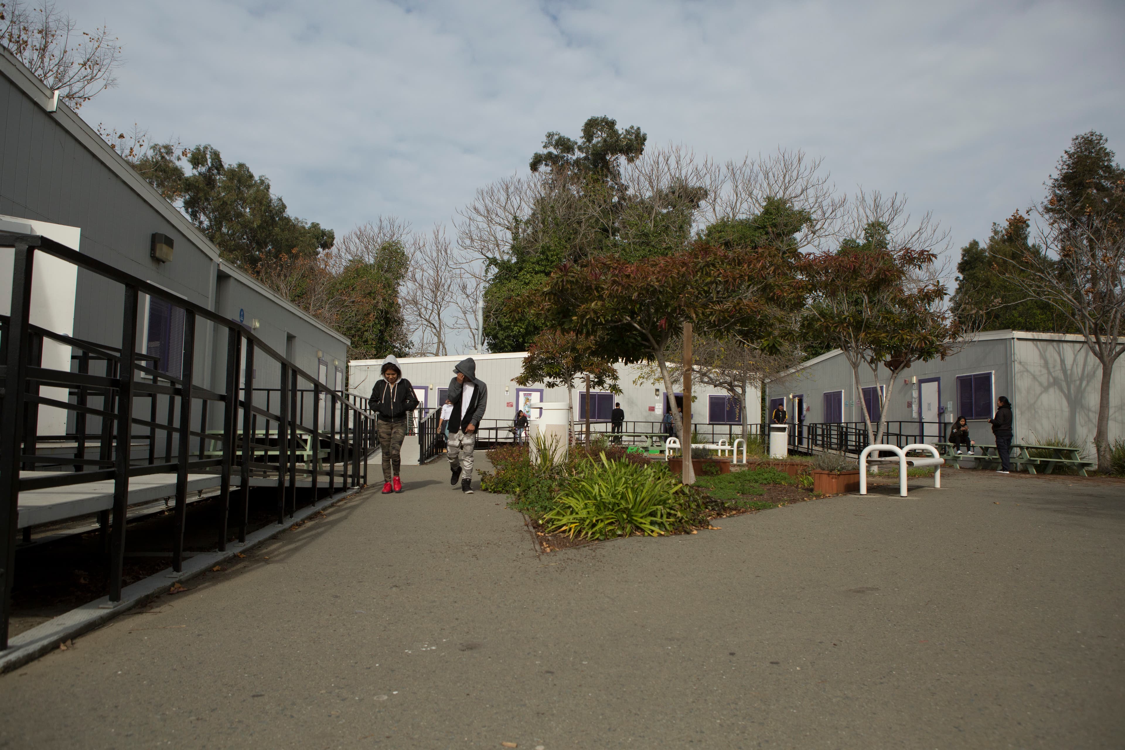 A school campus with small blue buildings