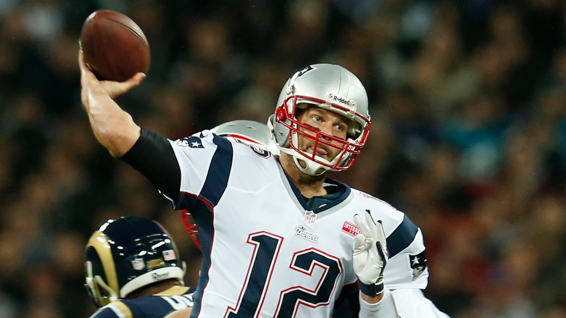 New England Patriots quarterback Tom Brady throws a pass against the St. Louis Rams in Wembley Stadium in London at one of the NFL's regular games played outside of the US, October 28, 2012. The Rams relocated back to Los Angeles in 2016.