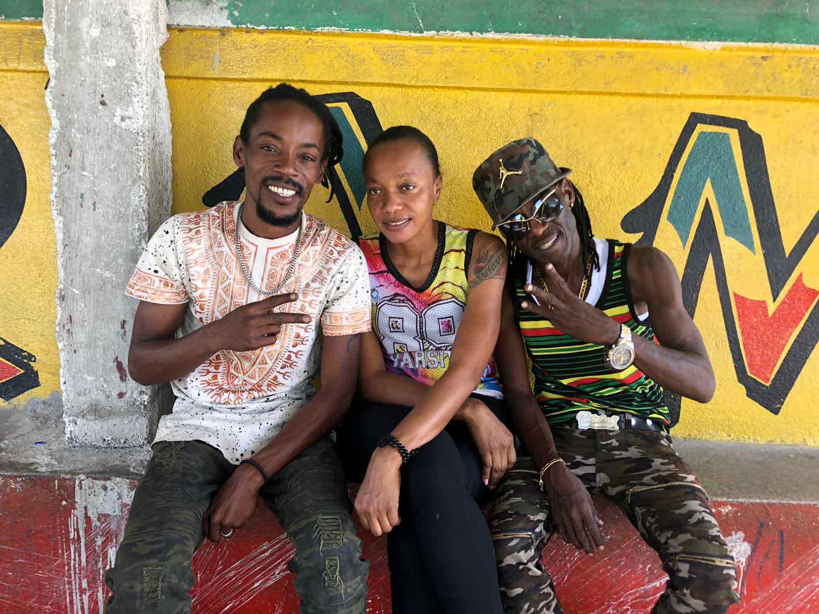 Three people post for a photo