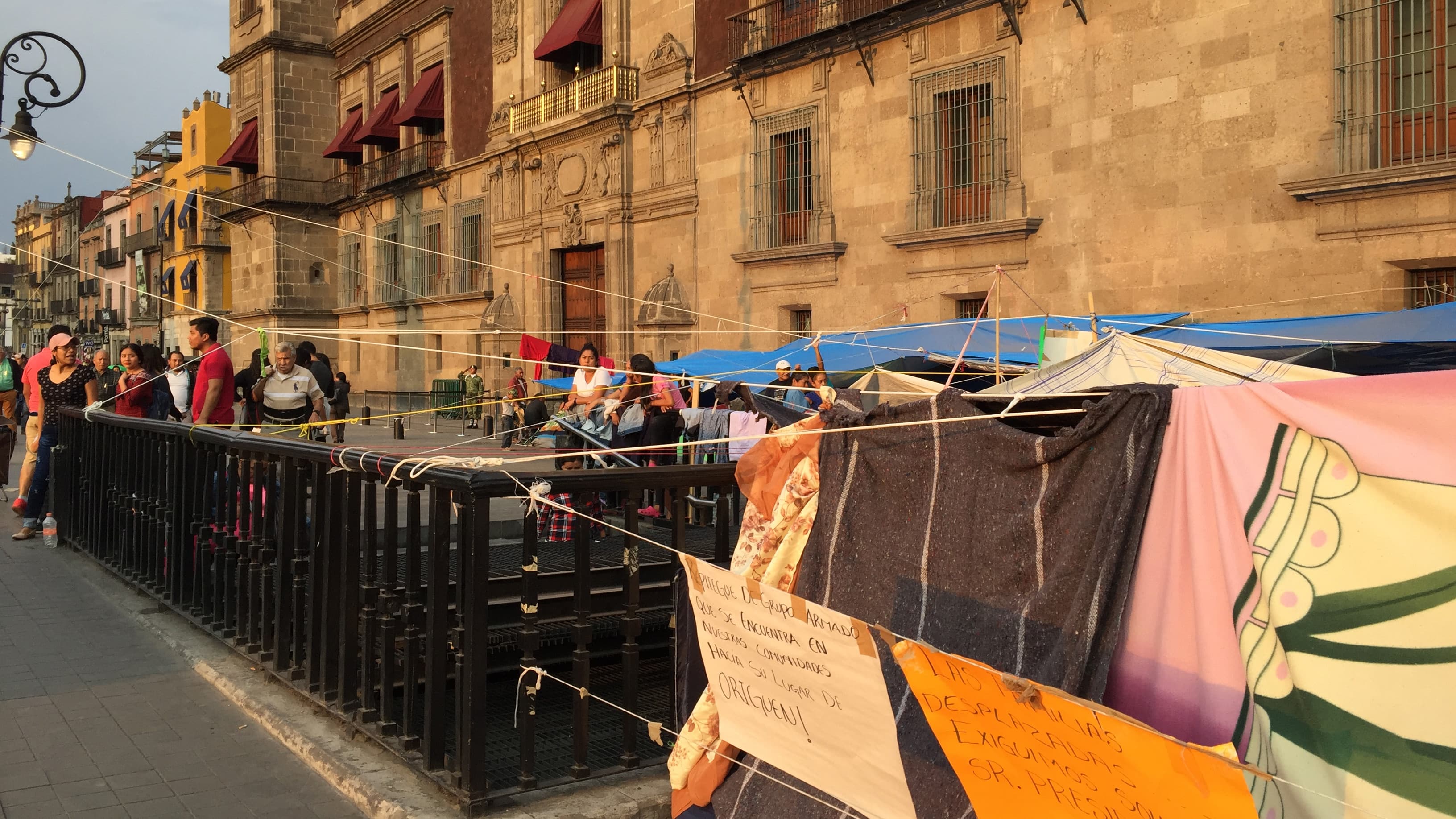 protestors in the front of the national palace in mexico