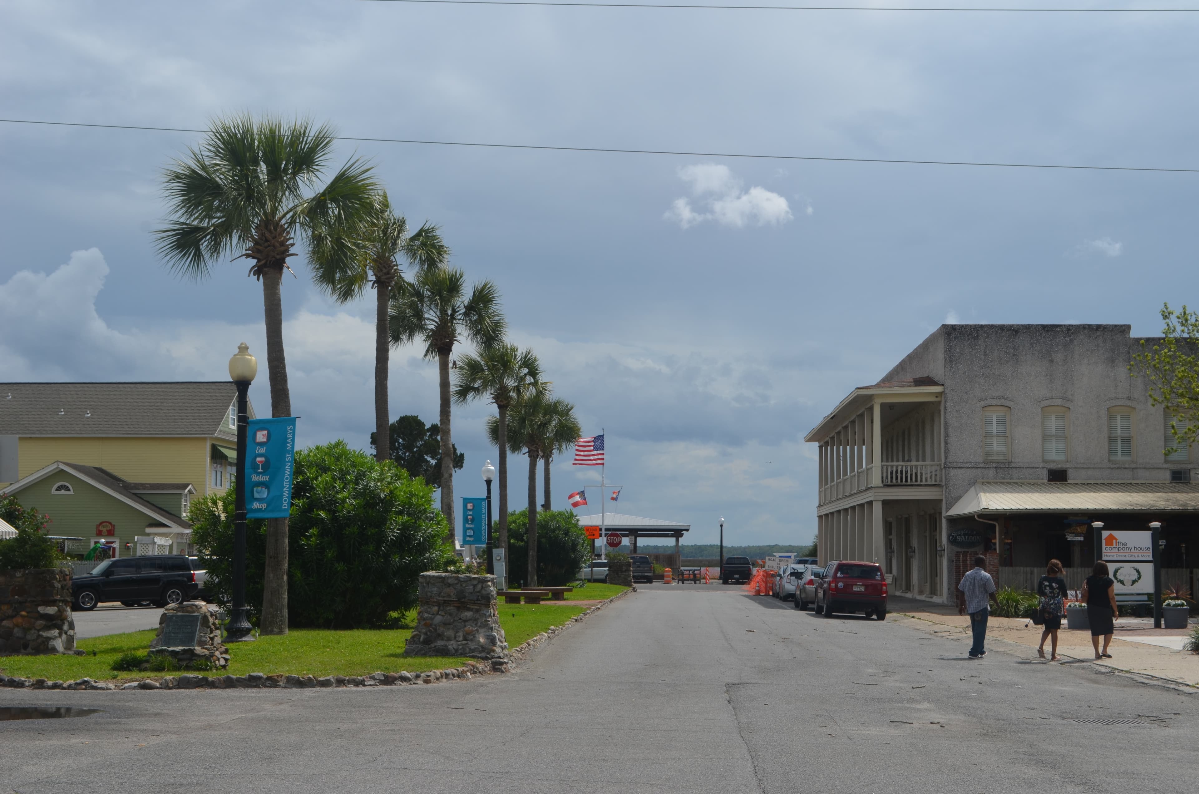 Scenic downtown St. Mary, Georgia, lined with palm trees and storefronts.