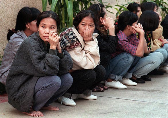 Thai women sitting on a sidewalk in El Monte, California