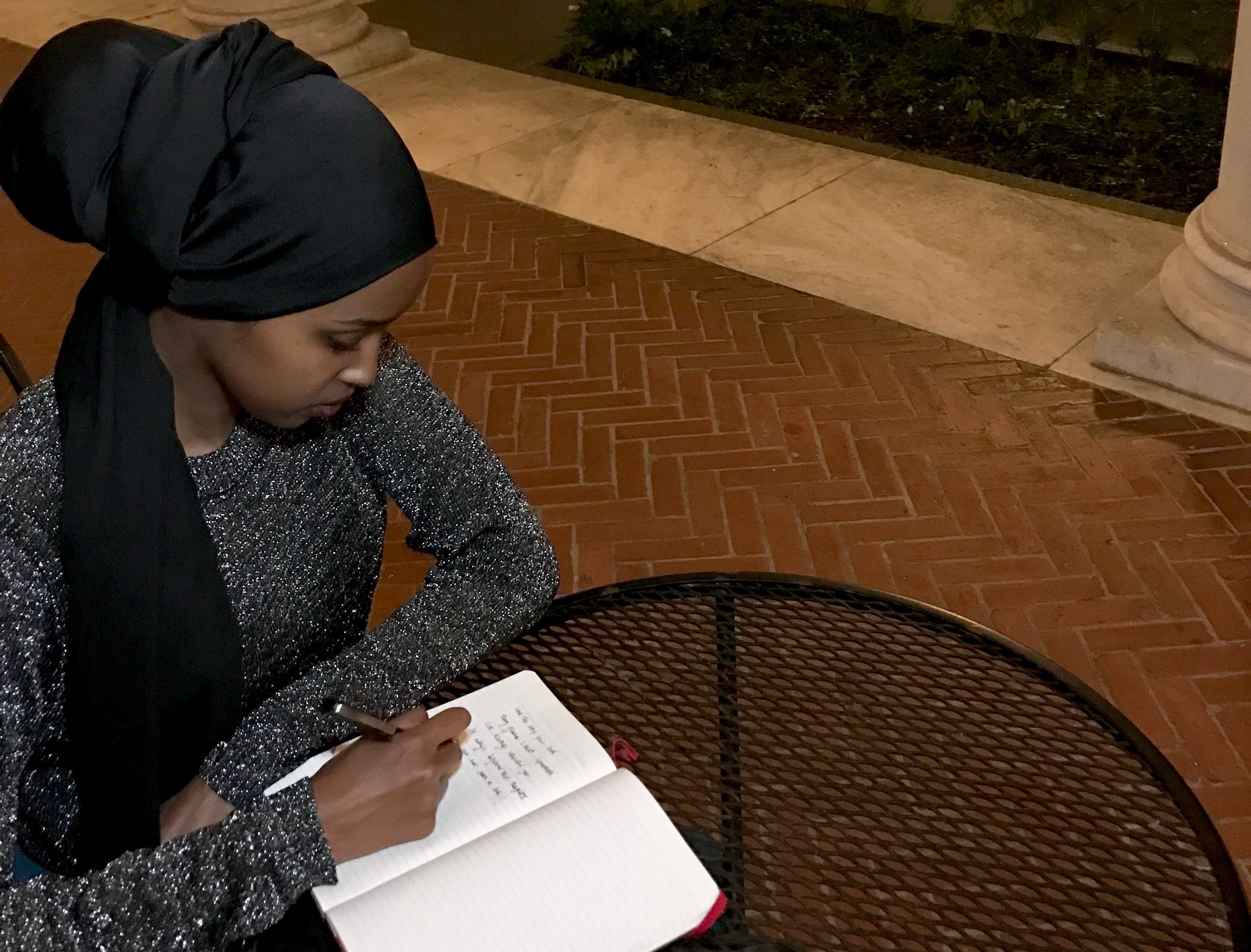 Amal Hussein writes poetry for her performance