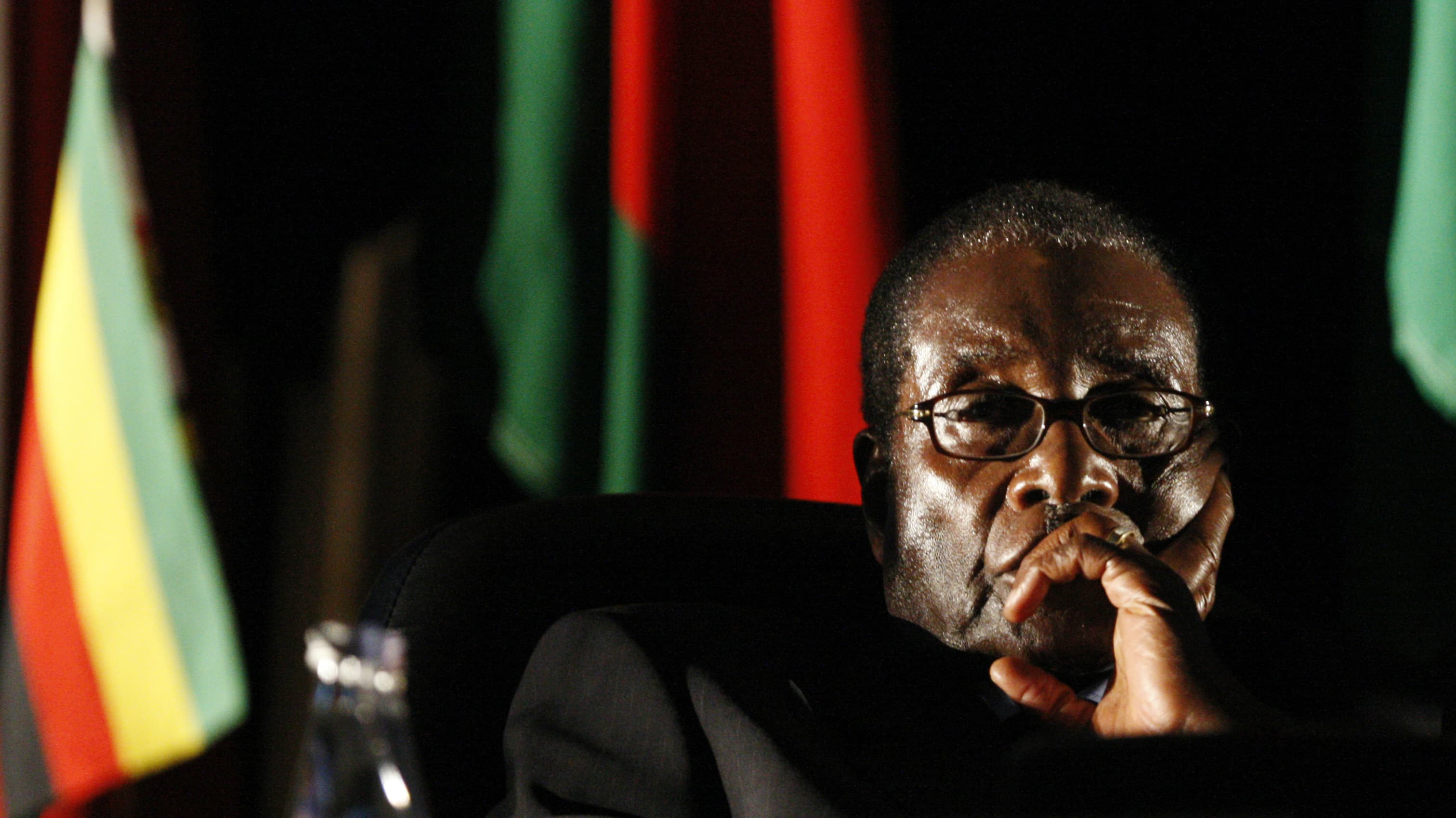 Zimbabwean President Robert Mugabe watches a video presentation during the summit of the Southern African Development Community in Johannesburg, Aug. 17, 2008. Mugabe ruled for 37 years before resigning on Nov. 21, 2017, following a military takeover.