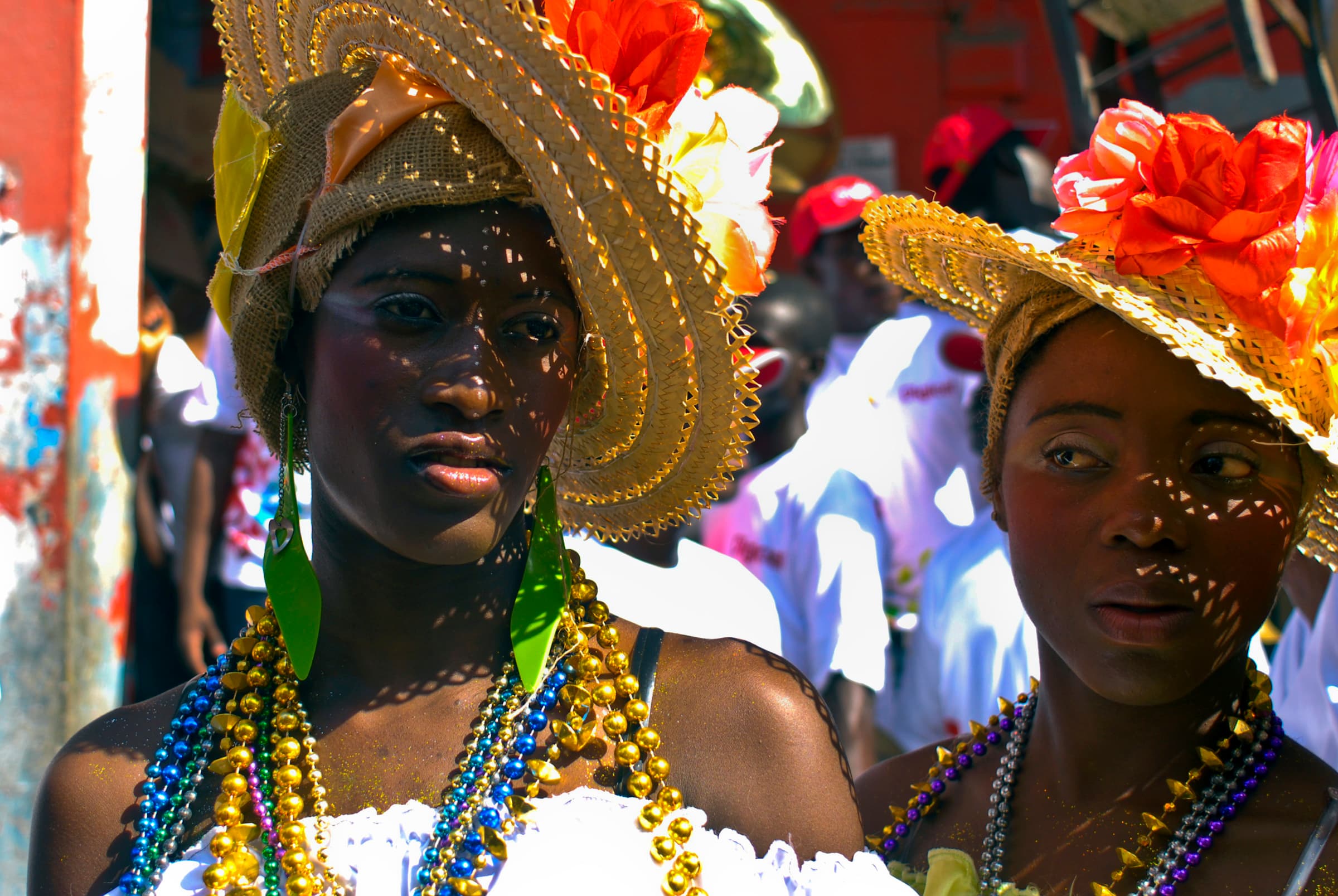 Women wear costumes as they take part in Carnaval in Jacmel, Haiti. The similarity between Carnaval and Mardi Gras in New Orleans is just one connection the two places share.
