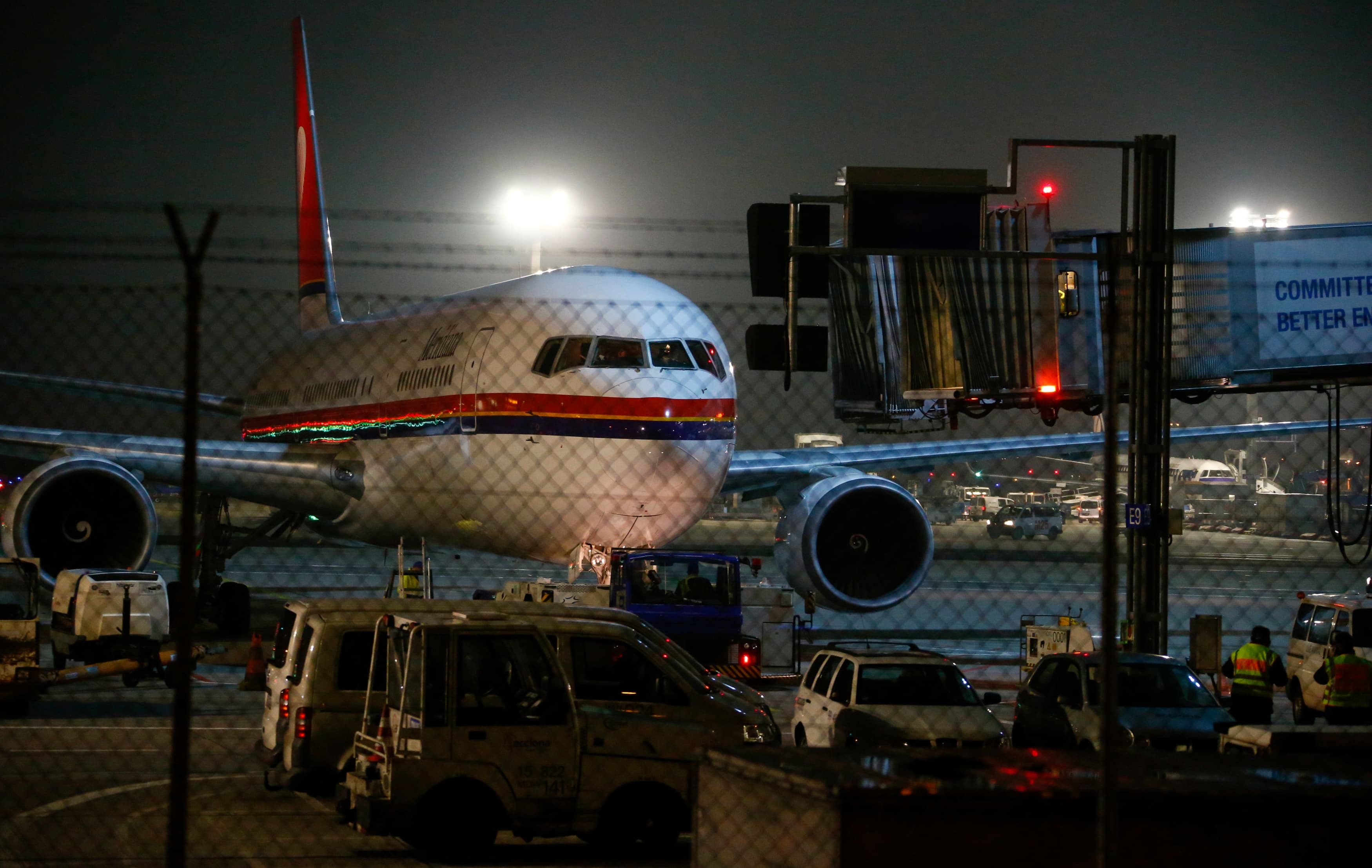 A Meridiana Airlines plane believed to be flying a group of about 50 rejected asylum seekers leaves from Frankfurt Rhein-Main Airport in Germany, Dec. 14, 2016.