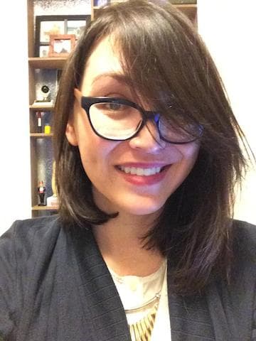 A woman looks at the camera