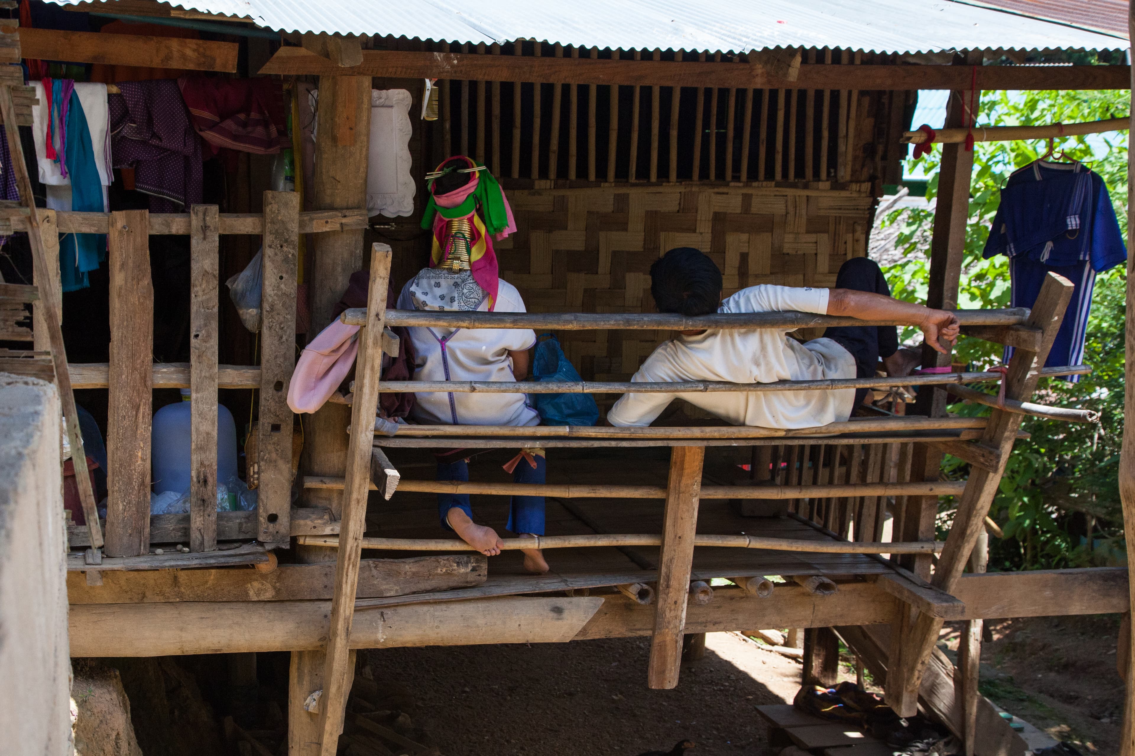 One of the women at Huai Sua Tao rests at her home while there are no tourists visiting. Most of the village's business is during the winter months, as few tourists come during the monsoon and dry seasons.