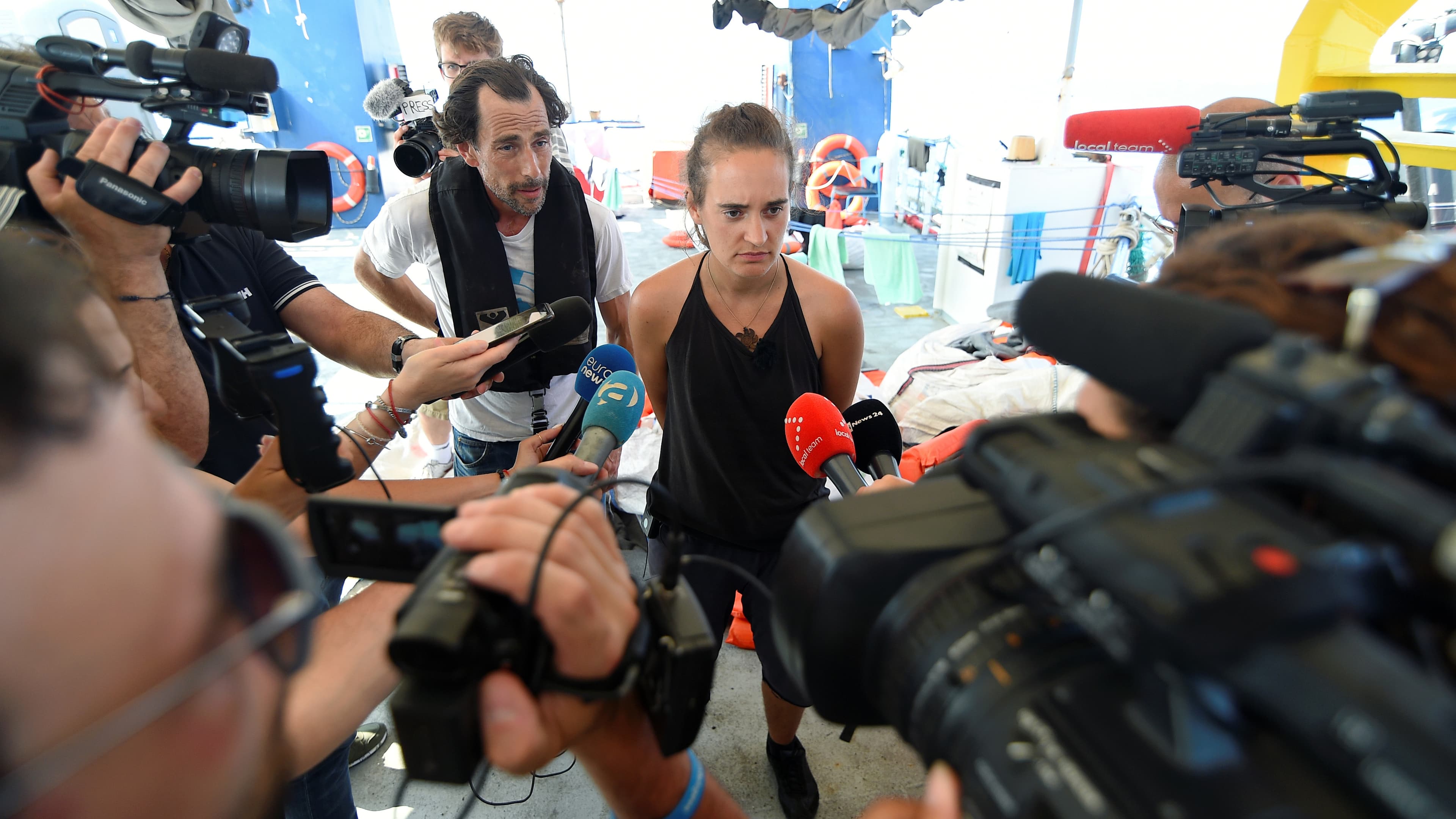 Carola Rackete speaks to reporters on her ship