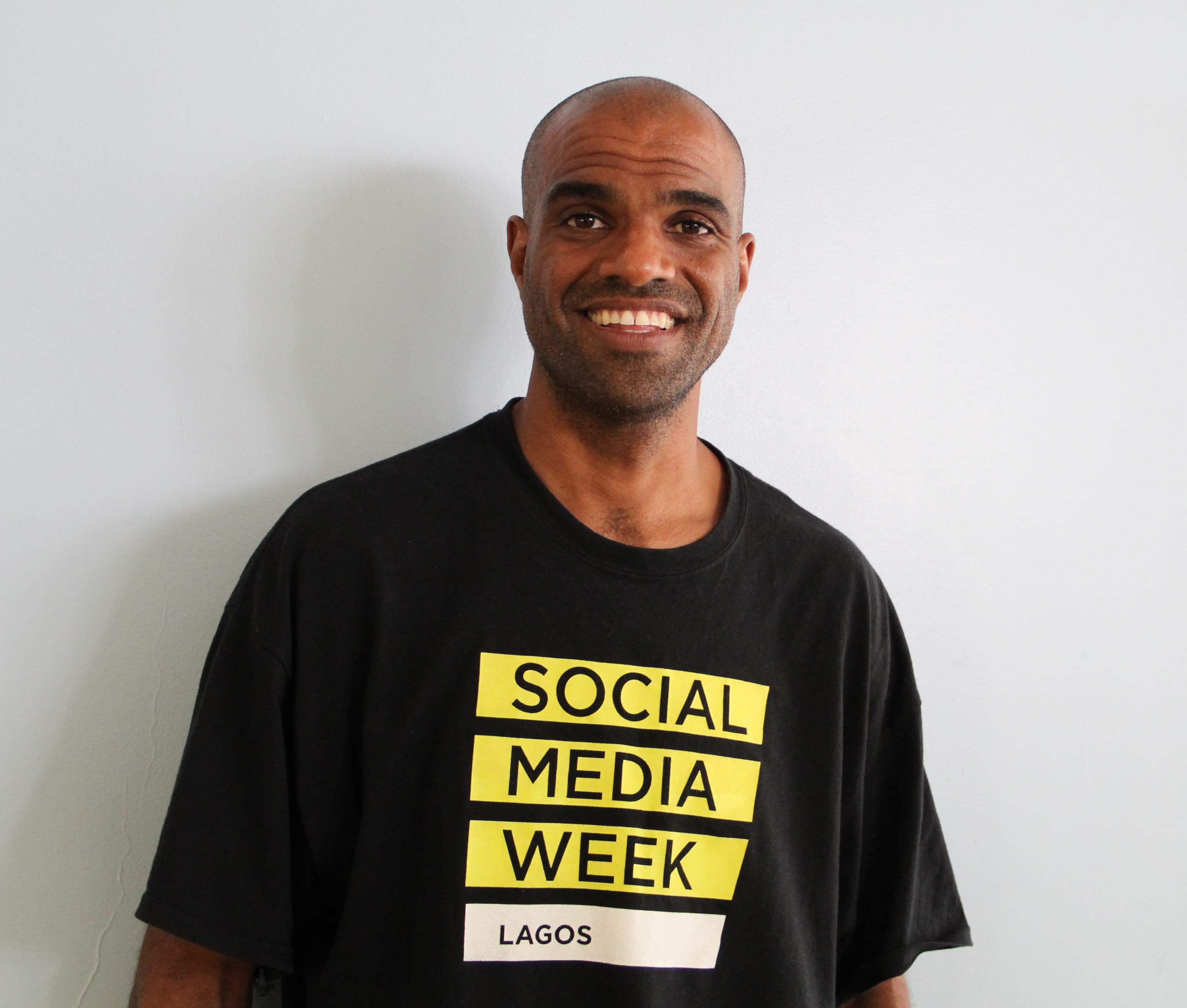 Hakeem Jima poses for picture wearing Lagos black shirt.