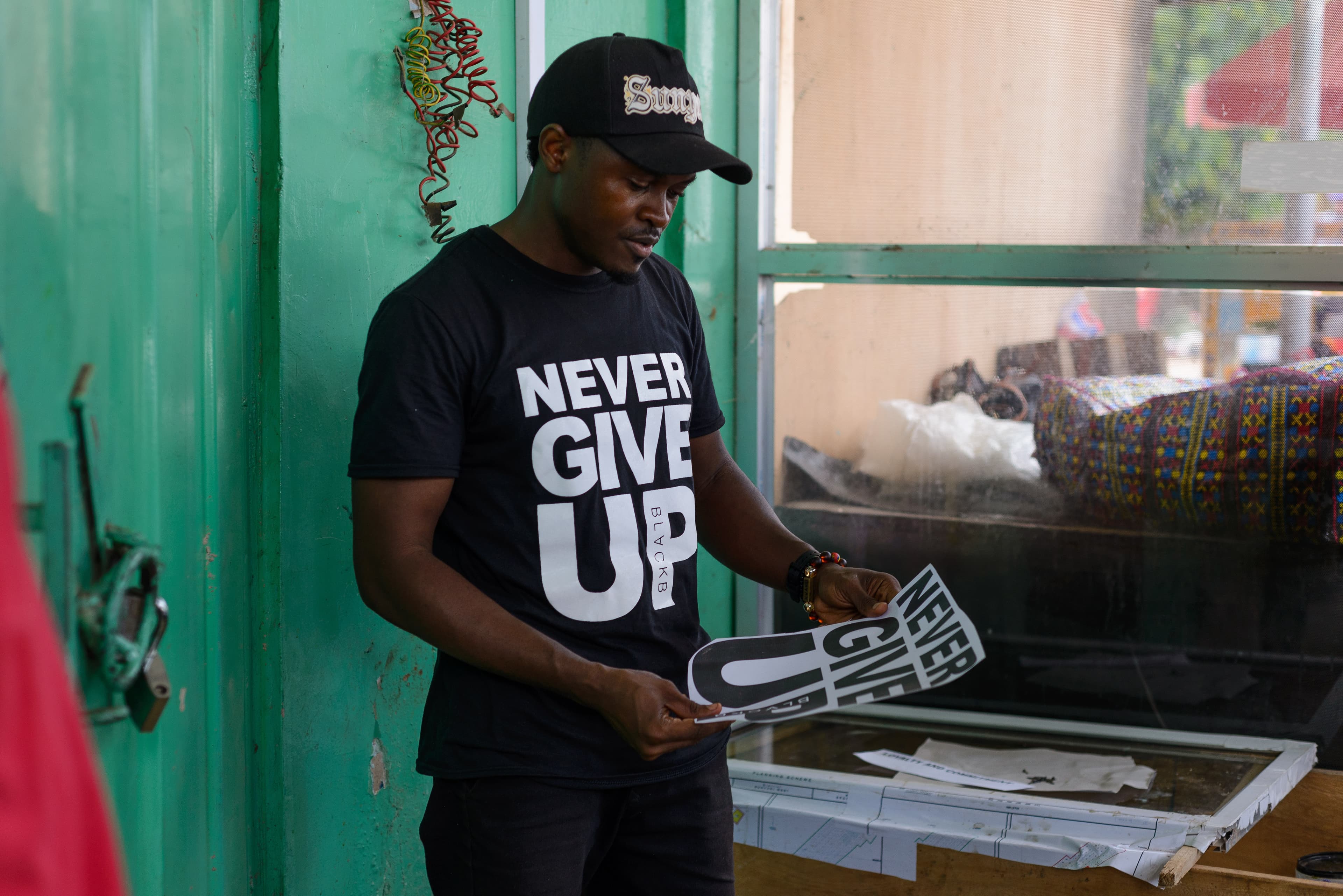 Designer looks at his screen print design